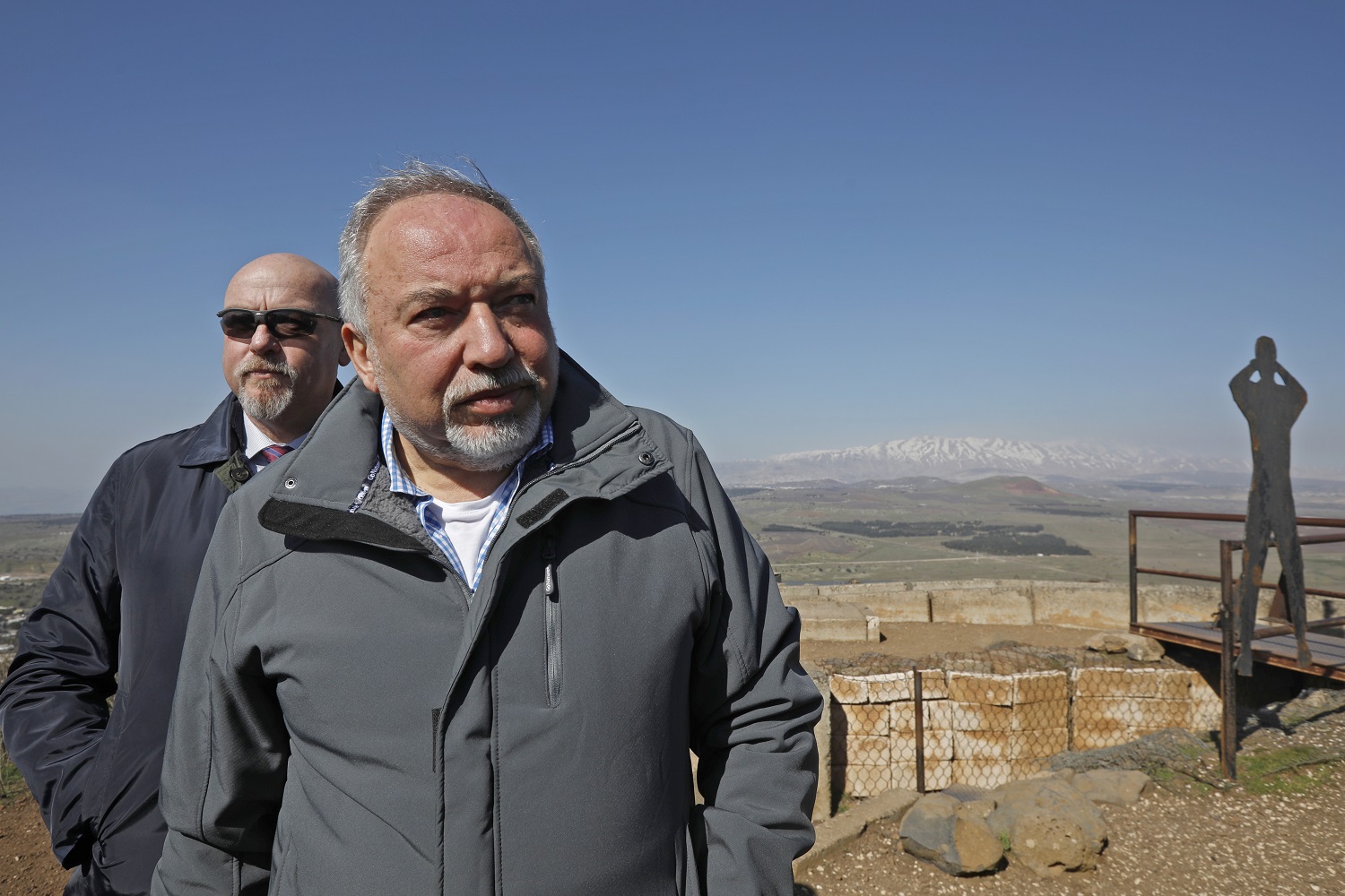 Avigdor Lieberman visits a lookout on  Mount Bental in the Golan Heights in February 2019 (AFP)