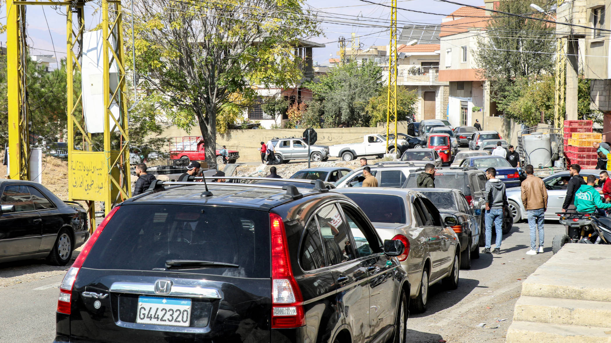 Vehicles condense along a road as residents of Lebanon's eastern city of Baalbek flee following an Israeli bombing notice (Nidal Solh/AFP)