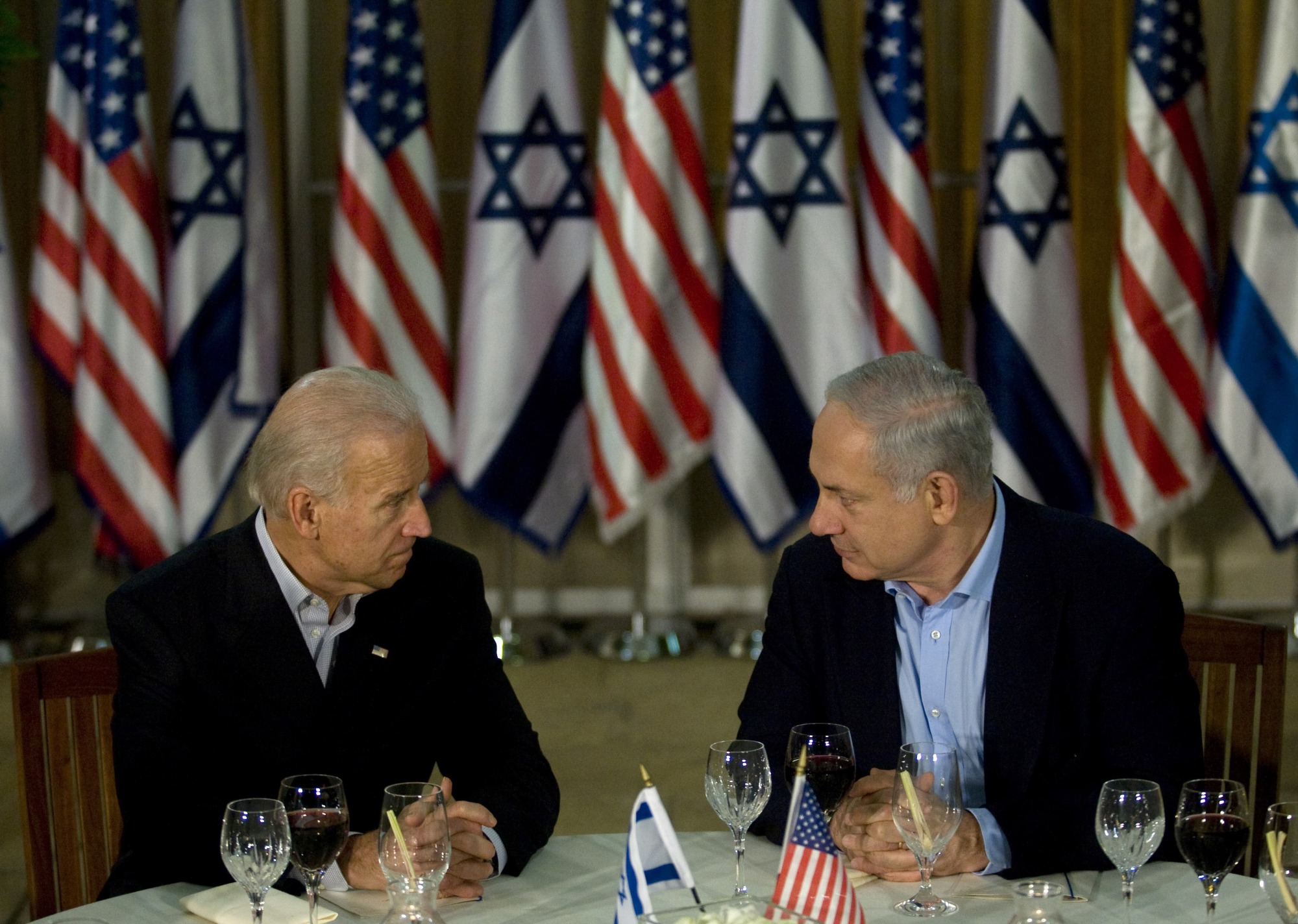 Then-US Vice President Joe Biden, left, and Israeli Prime Minister Benjamin Netanyahu sit down for dinner at the prime minister's residence in Jerusalem on 9 March 2010 (AFP)