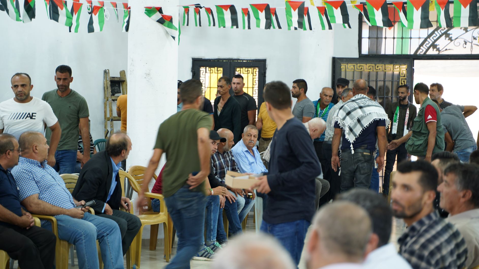 People gather for the funeral of Muhammed al-Allami (MEE/Yumna Patel)