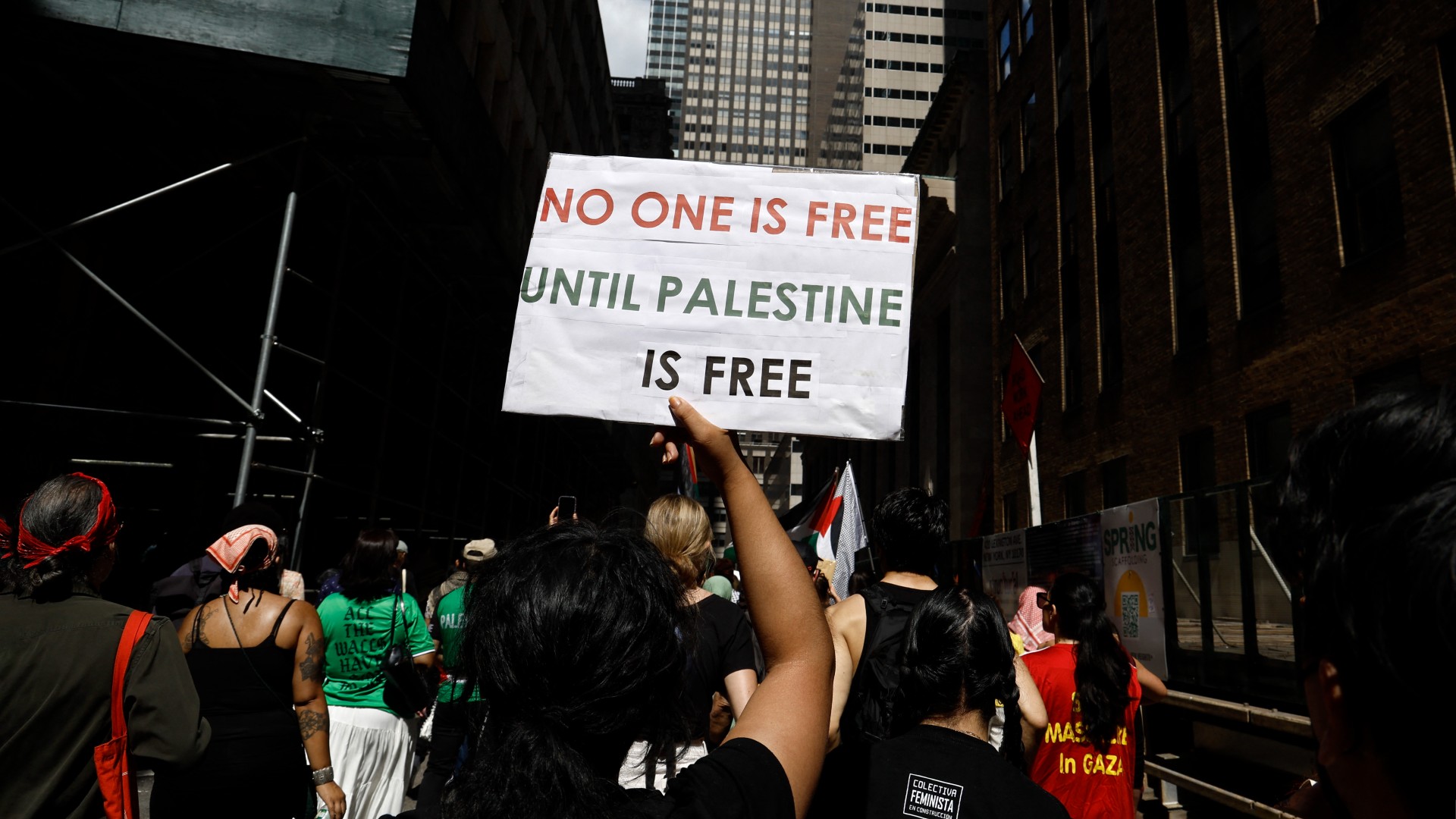 Demonstrators rally through the streets with signs and Palestinian flags to protest the conflict in Gaza and the occupied West Bank on September 2, 2024 in New York City,