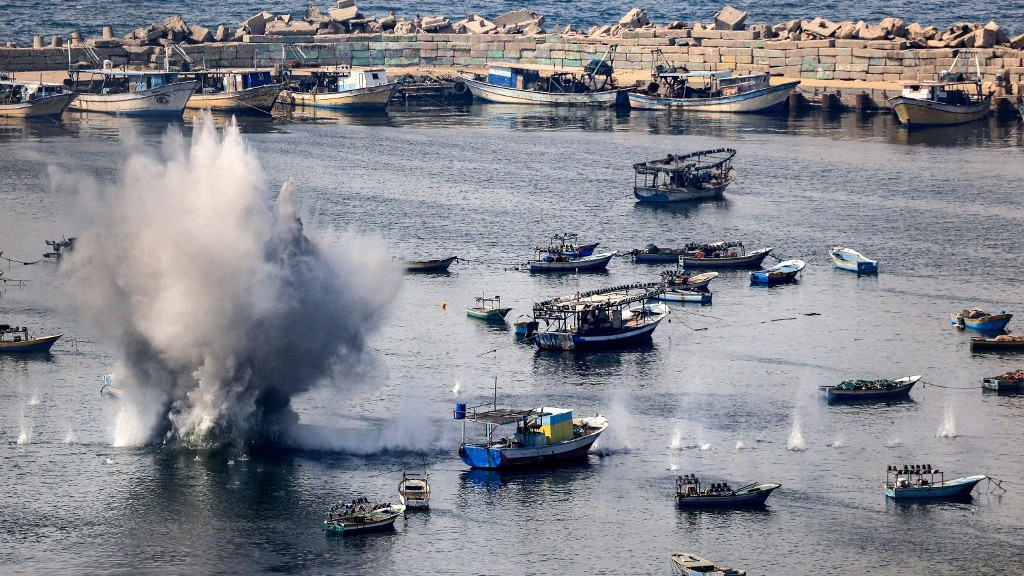 Gaza's seaport is shelled by Israel on 11 October 2023 (Mahmud Hams/AFP)