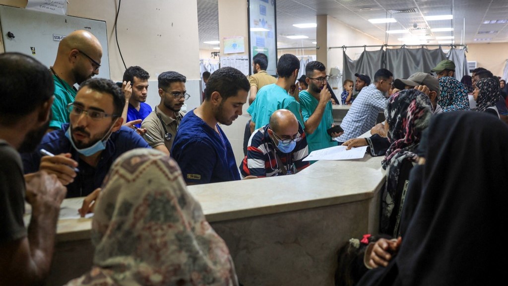 Palestinian medics, patients and their families at Nasser Hospital on Wednesday after they evacuated from European Gaza Hospital following evacuation orders by the Israeli army (Eyad Baba/AFP)