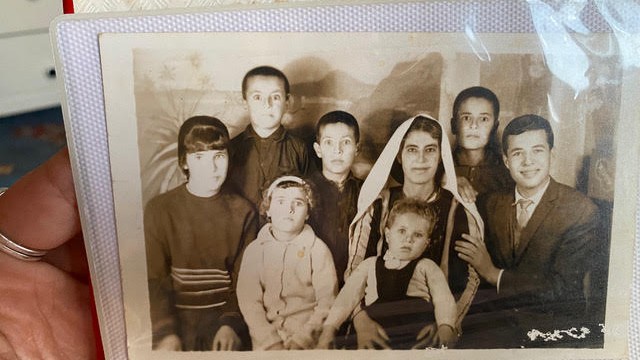 one of the oldest picture in the album where my grandmother a survivor of the nakba with all my uncles  
