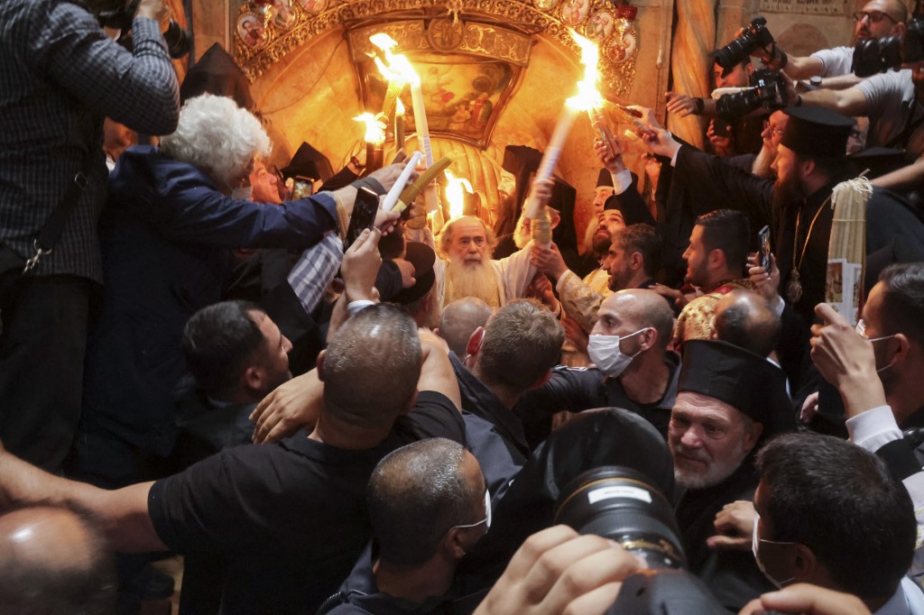 Greek Orthodox Patriarch of Jerusalem Theophilos III during the Holy Fire ceremony at Jerusalem's Holy Sepulchre church, 23 April 2022 (AFP)
