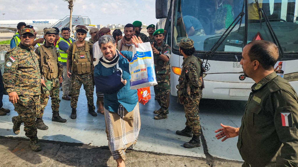 Houthi prisoners at Aden on their way to Sana, 14 April 2023, part of an exchange of prisoners from Yemen's civil after a Saudi delegation held talks with the Iran-backed Houthi rebels (AFP)