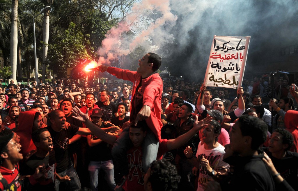 Fans of Al-Ahly football club shout anti-government slogans on 4 April 2012, demanding justice for the victims of the Port Said stadium riots (AFP)