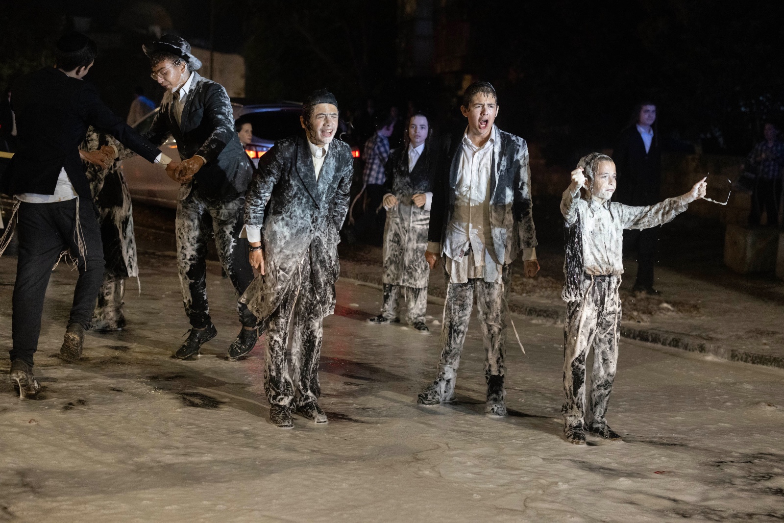 Ultra-Orthodox protesters are sprayed with foam during the protest in Jerusalem (MEE/Orev Zin)