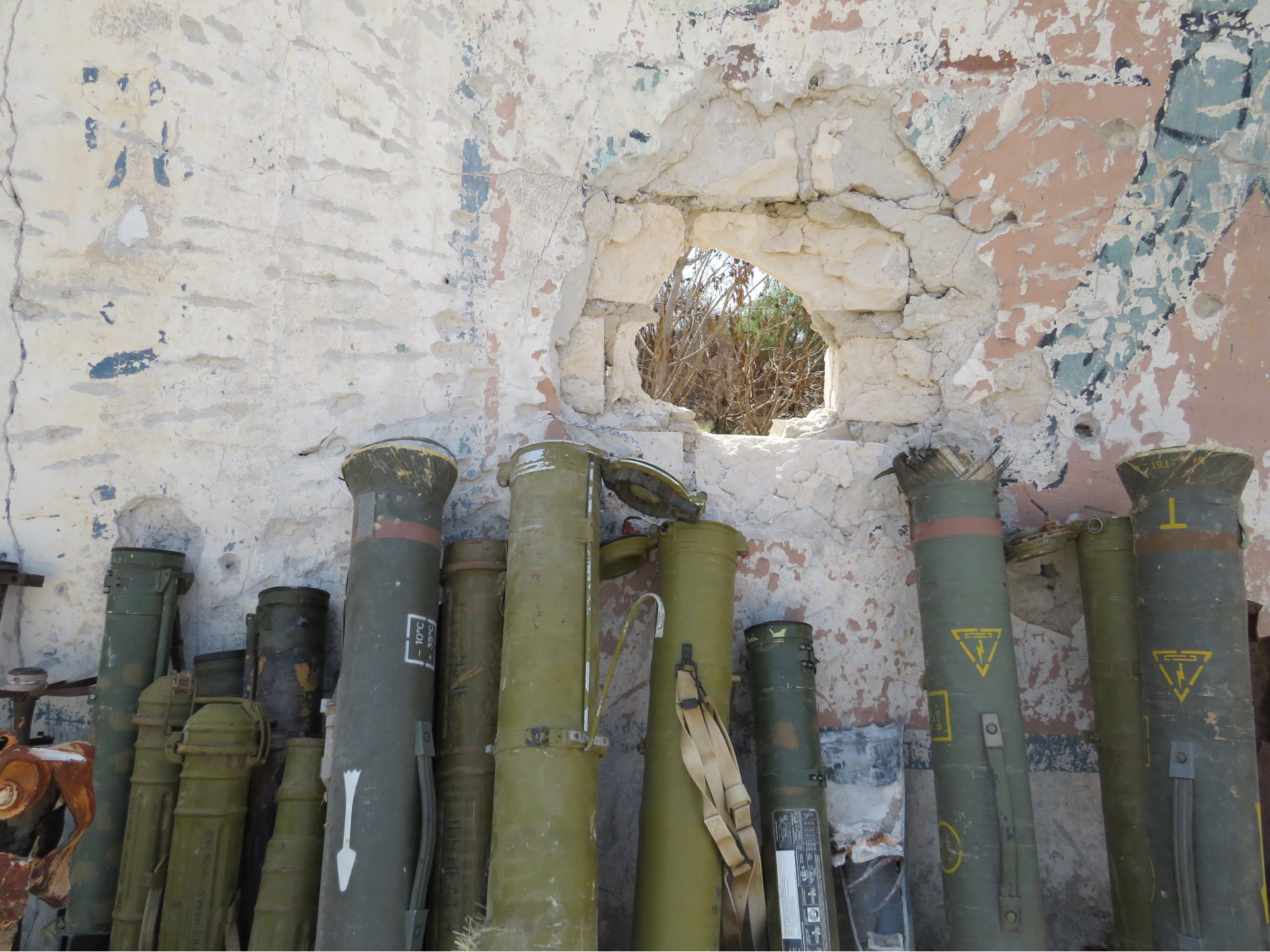 Rocket launchers recovered from residential battlefields and brought to a military base in Tripoli (MEE/Daniel Hilton)