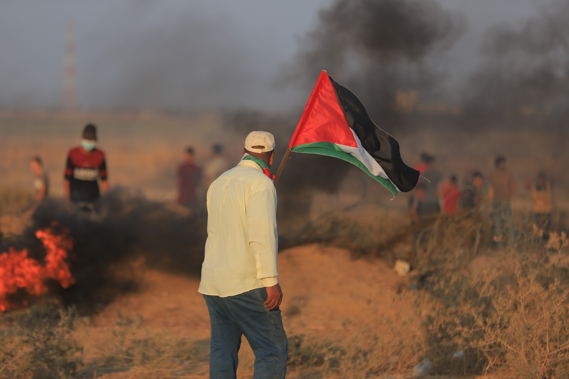 A Palestinian man attends a protest on the Gaza boundary on 25 August 2021 (MEE/Mohamed Naief)