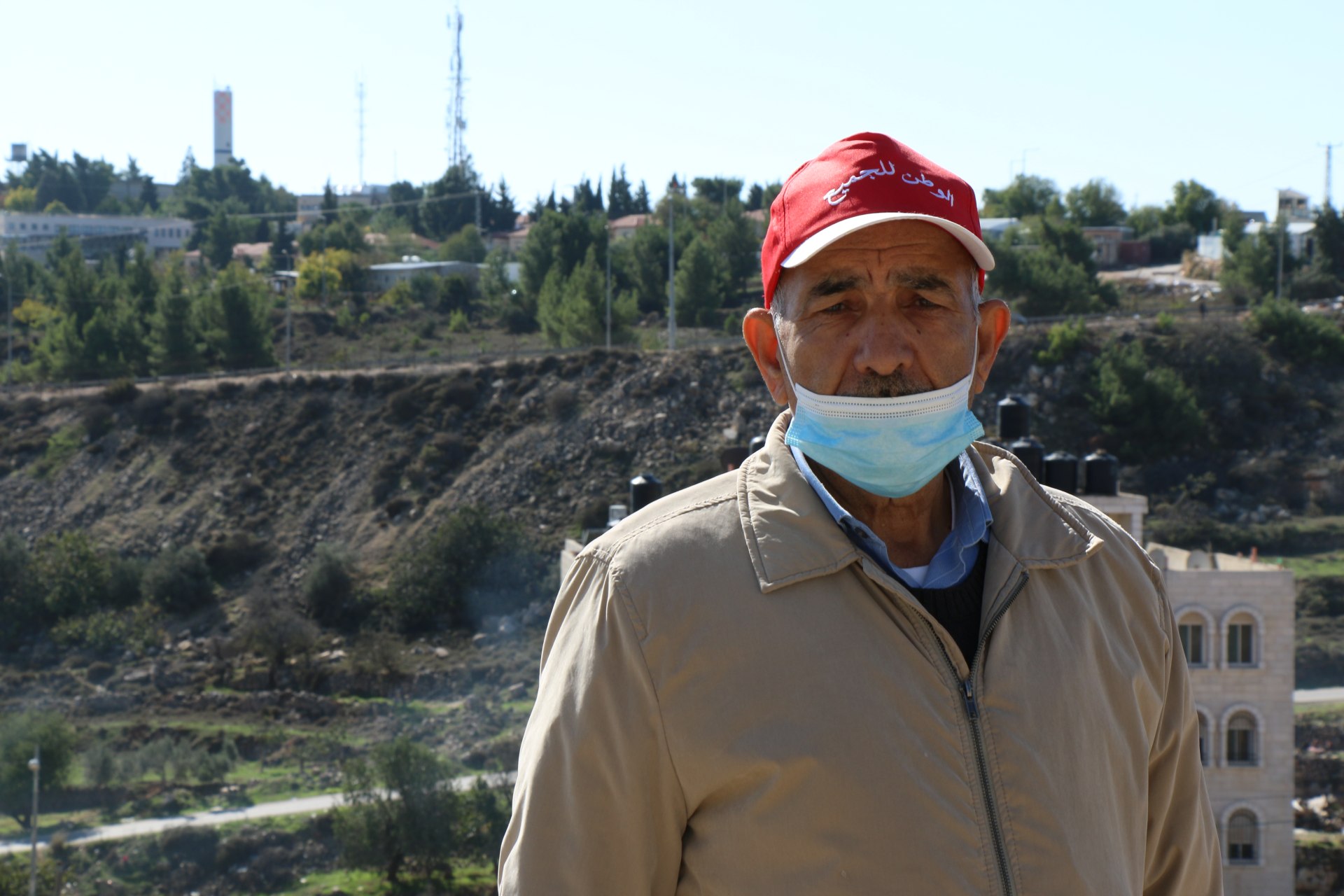 Jamal Salem protesting beside the Israeli settlement of Psagot (MEE/Akram al-Waara)