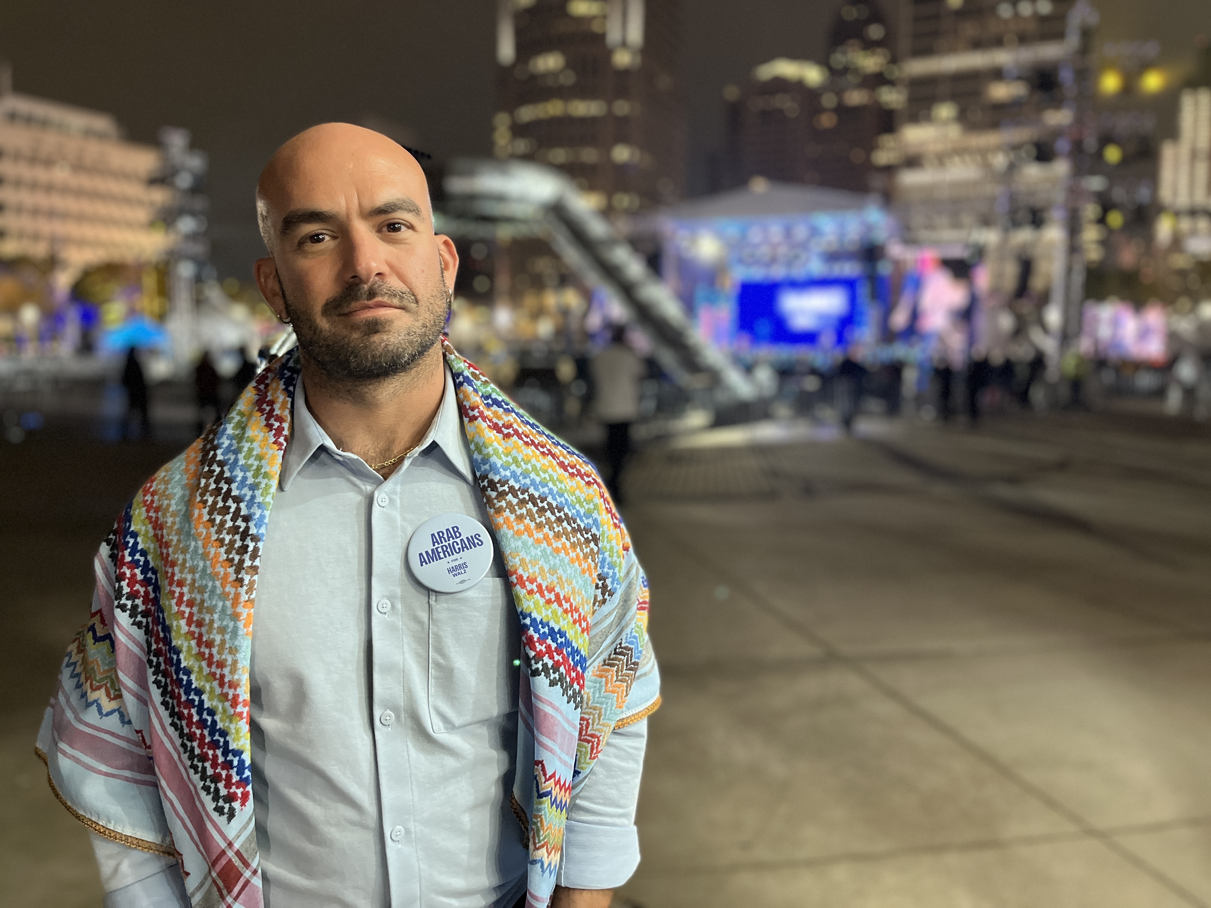 Arab-American Democrat Salem Almaani awaits remarks by Tim Walz at a campaign rally in Detroit, Michigan, on 4 November, 2024 (Yasmine El-Sabawi/MEE)