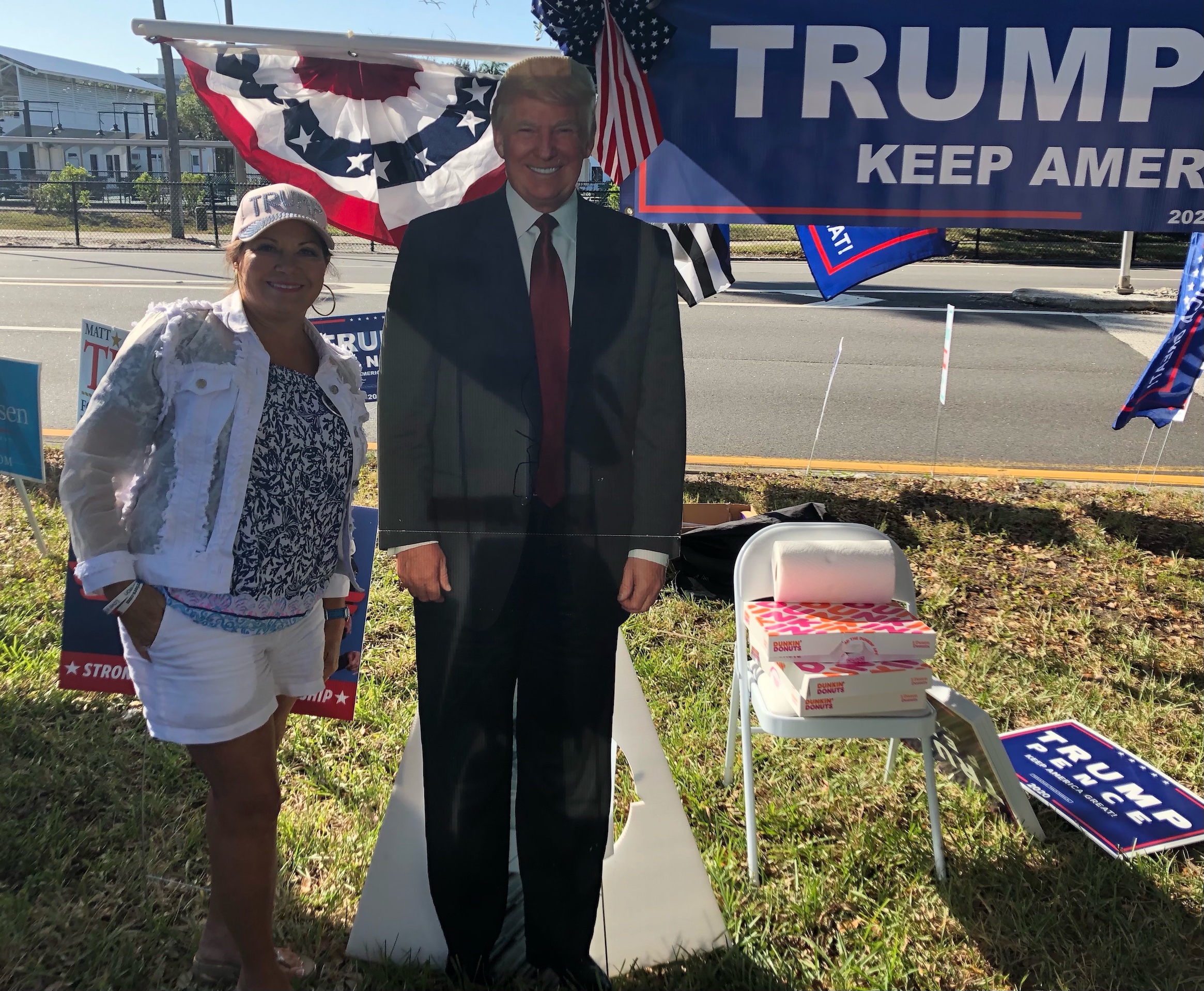 Melodie Stang, a real estate broker and an enthusiastice advocate for President Donald Trump, outside a St Petersburg, Fl voting site on 3 November (MEE/Sheren Khalel)