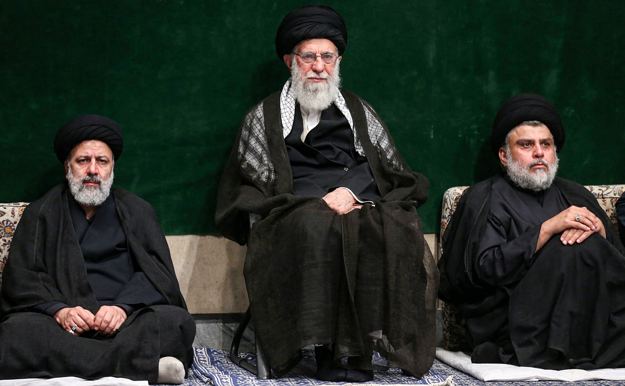 Iranian judiciary chief Ebrahim Raisi, left, Supreme Leader Ayatollah Ali Khamenei, centre, and Iraqi militia leader Muqtada al-Sadr attend an Ashura ceremony on 10 September 2019 (AFP/Handout)