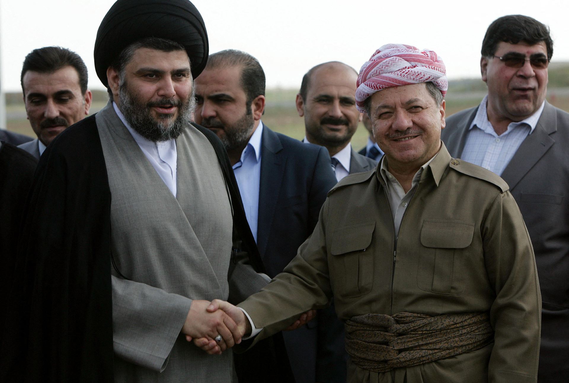 Muqtada al-Sadr (L), with Masoud Barzani during a visit to Erbil in 2012 (AFP)