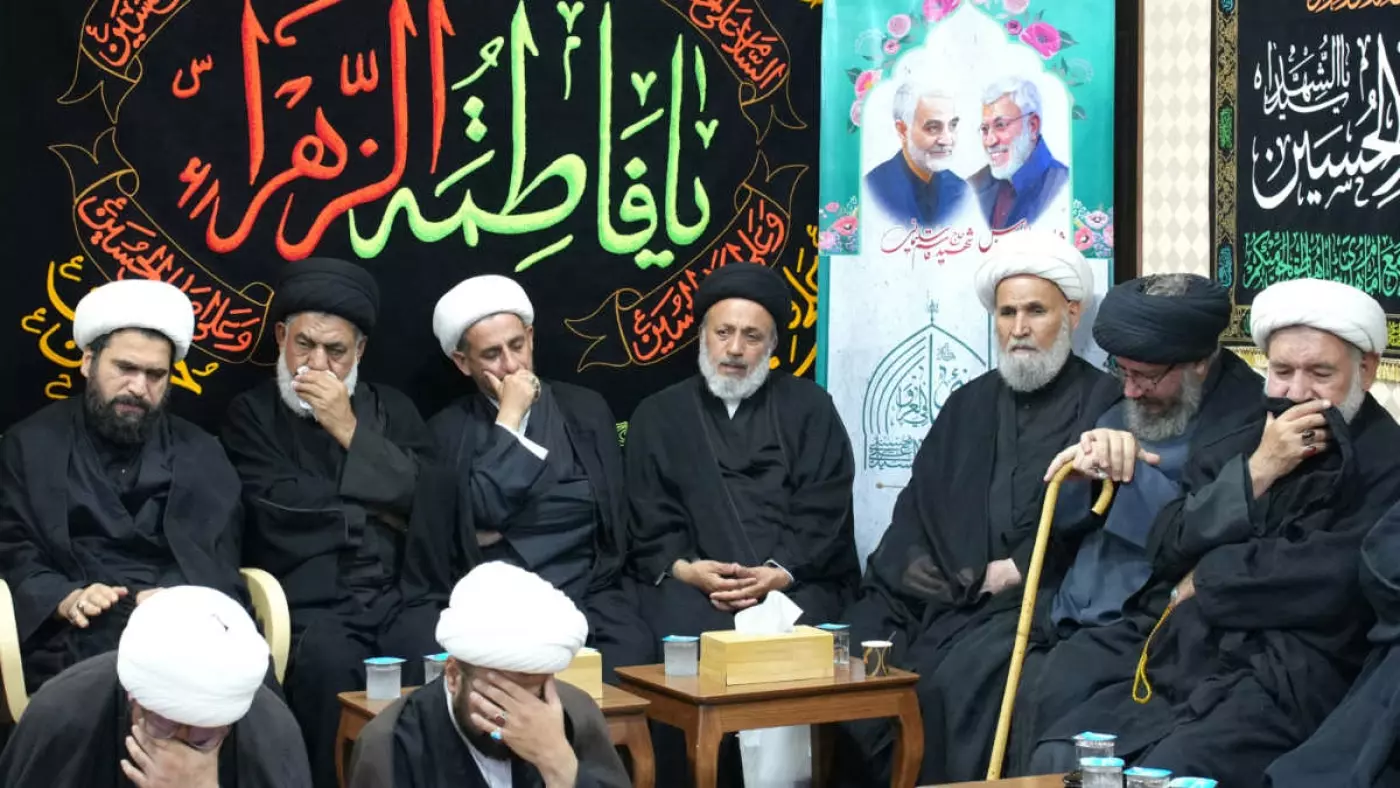  Iraqi and Iranian clerics and officials hold a vigil at office of the representative of Iran's supreme leader in Iraq's holy city of Najaf, following death of Hamas leader Ismail Haniyeh in a strike blamed on Israel, on 1 August 2024 (Qassem al-Kaabi/AFP)