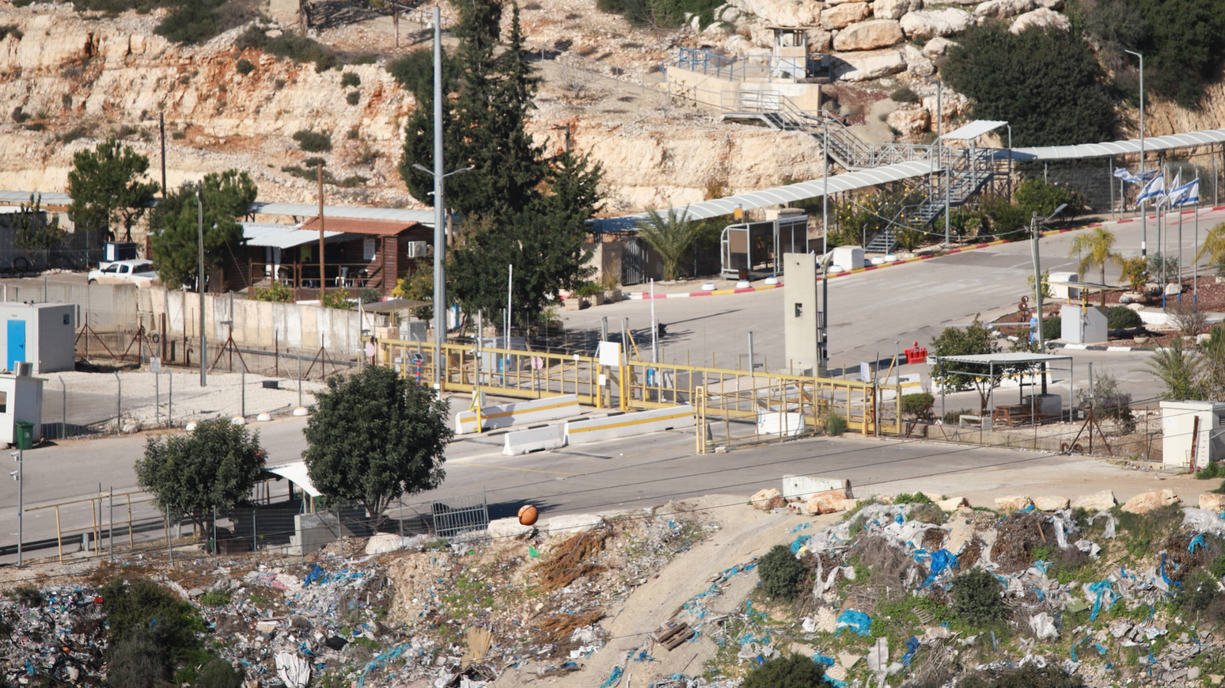 Israeli army close the iron gate at the entrance to Bartaa village west of Jenin (Muhammad Ateeq/MEE)