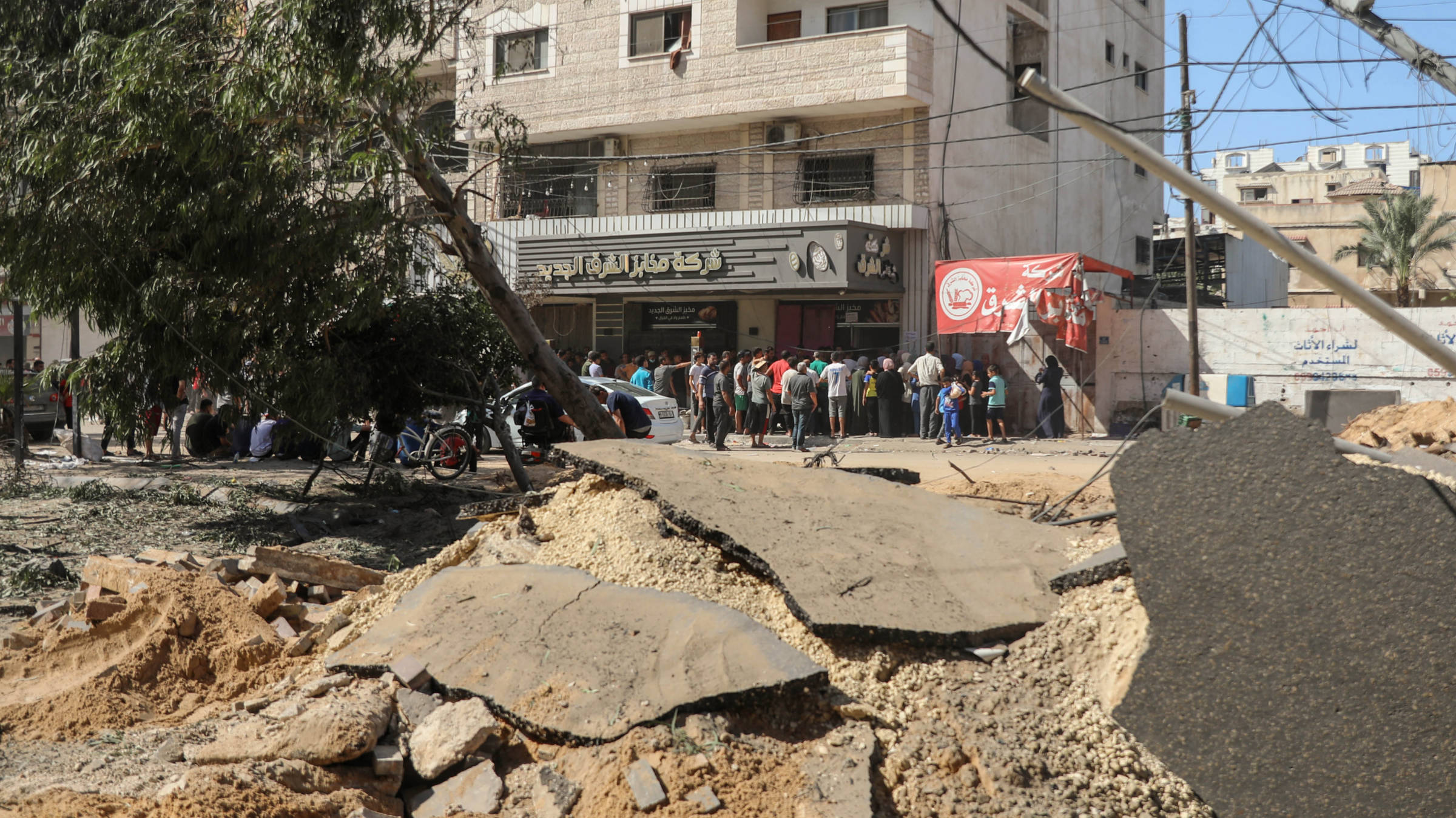 An Israeli strike hit the street in front of a bakery where moments earlier tens of people were queuing for bread, al-Jalaa street, Gaza (MEE/Mohammed al-Hajjar)