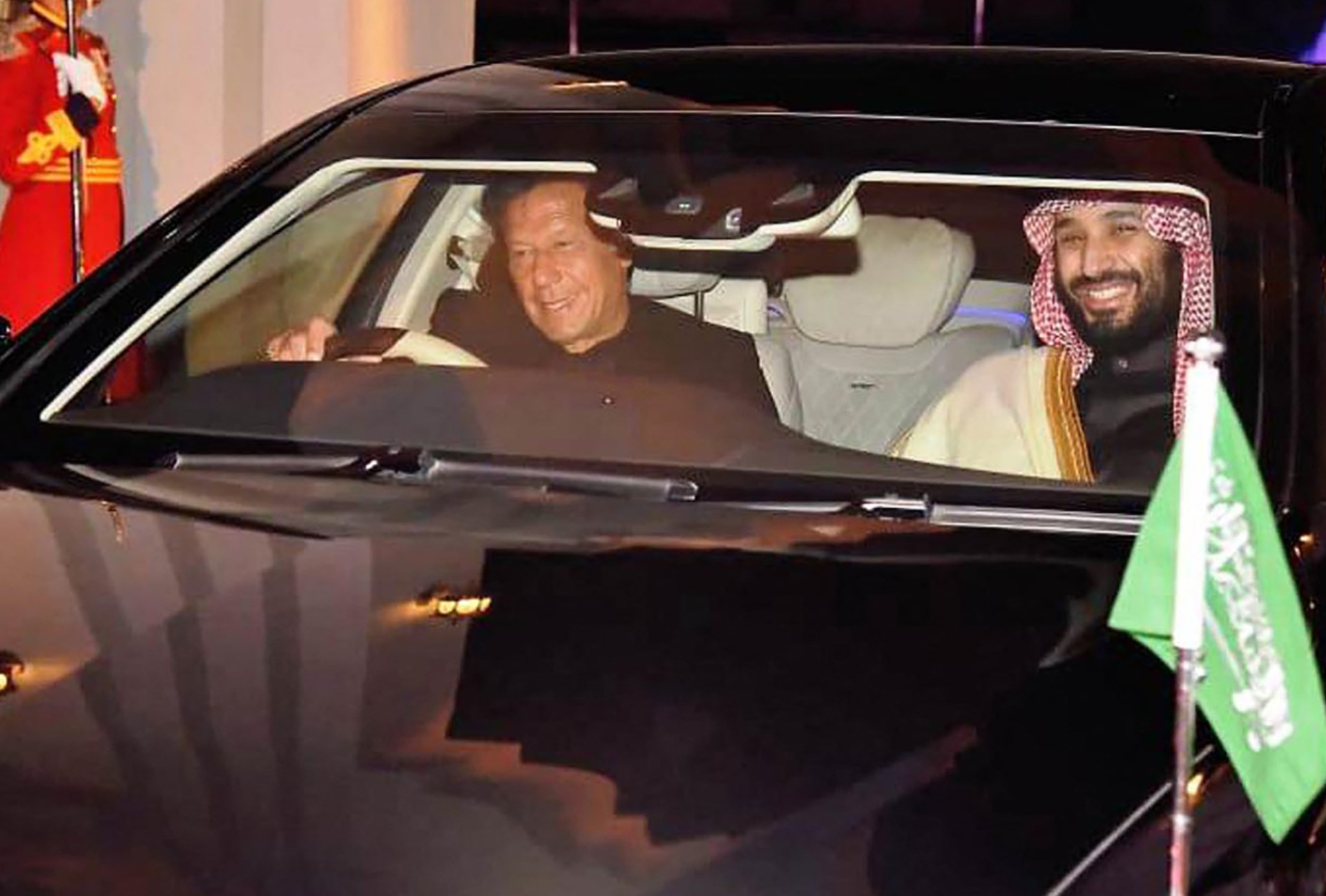 Imran Khan drives Mohammed bin Salman after the Saudi Crown Prince's arrival in Pakistan in February 2019 (AFP)