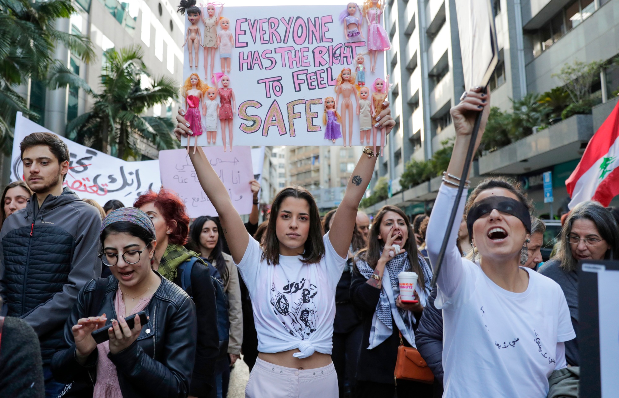 Activists take part in a demonstration against sexual harassment, rape and domestic violence in the Lebanese capital Beirut on 7 December 2019 (AFP)