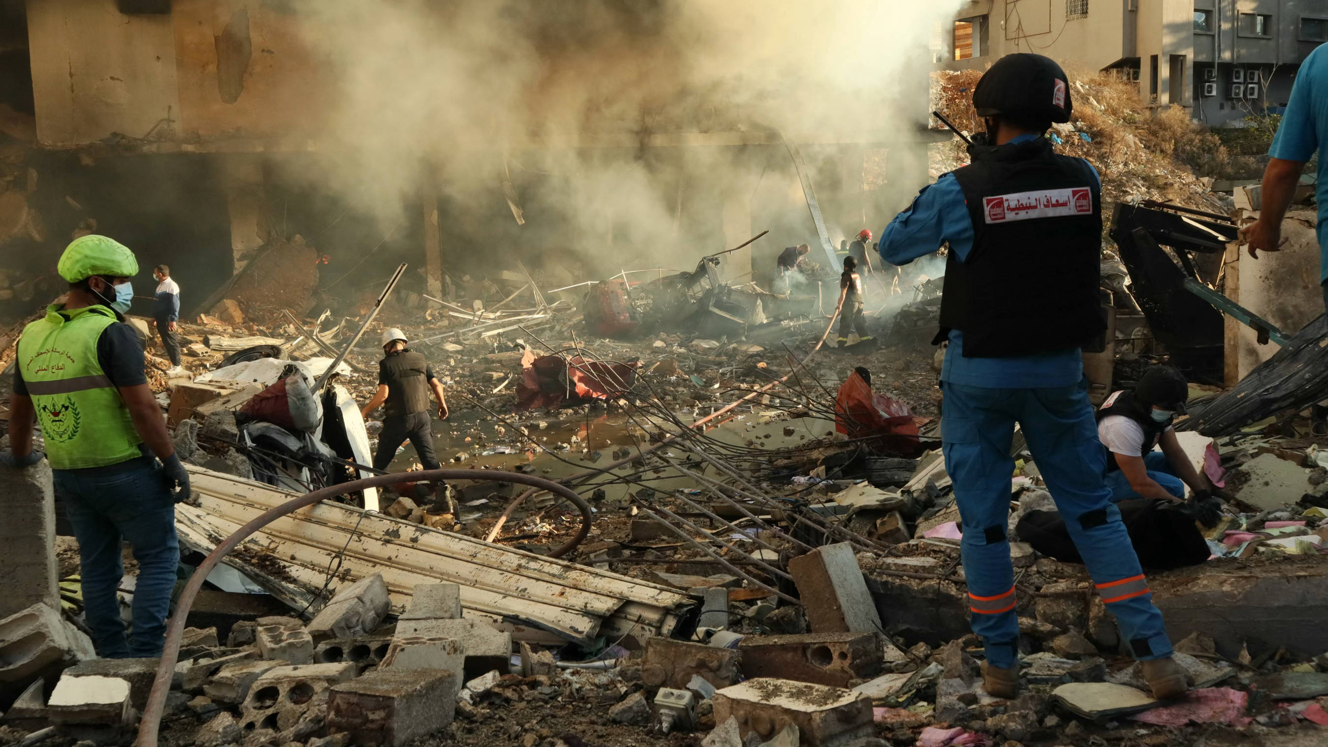 Rescuers search for survivors at the site of an Israeli air strike that targeted the southern Lebanese city of Nabatieh on 16 November 2024 (AFP)