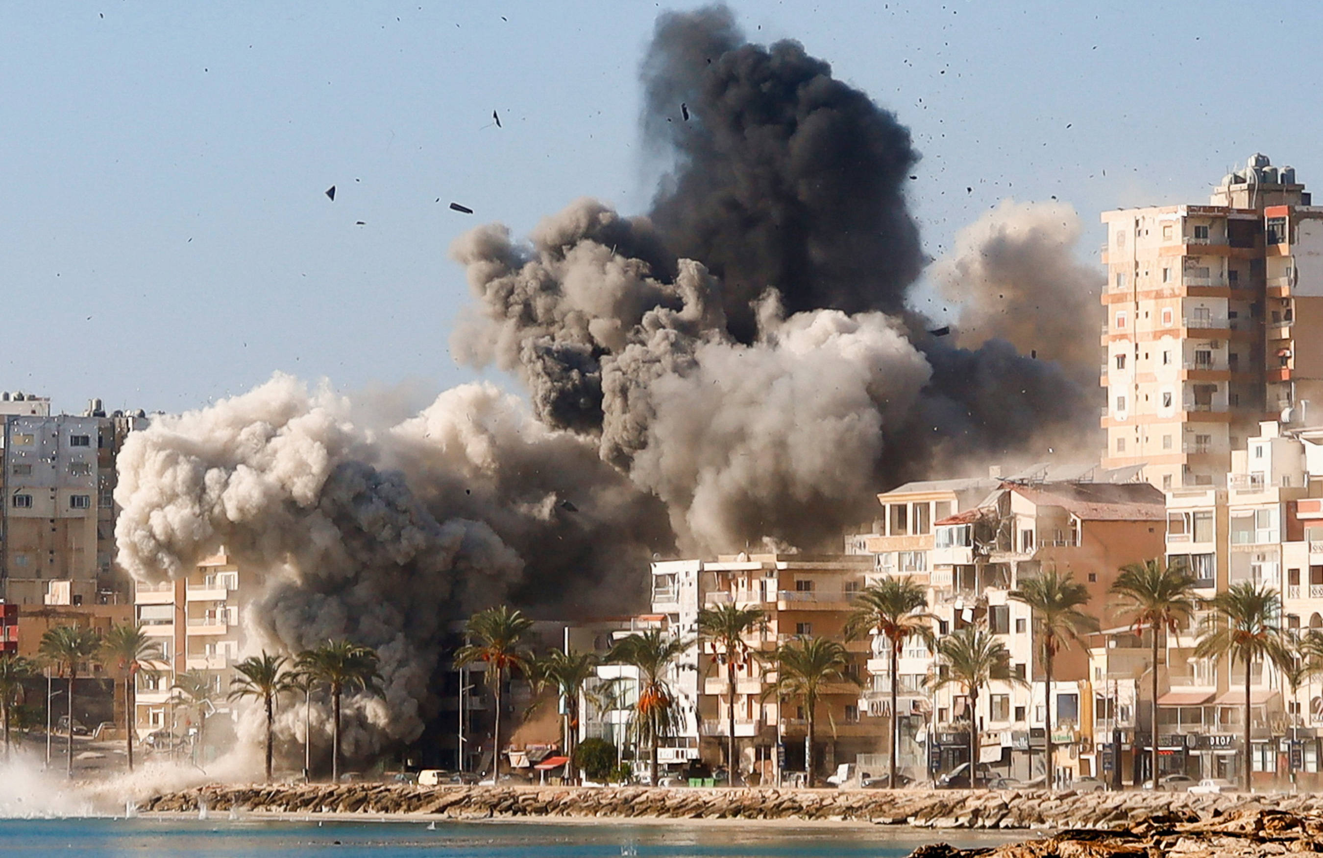 Smoke billows over the Unesco-listed port city of Sour, Lebanon, following Israeli strikes on 28 October 2024 (Reuters)