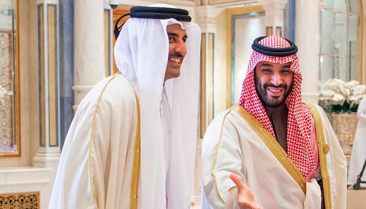 Saudi Crown Prince and Prime Minister Mohammed bin Salman, right, greets Emir of Qatar, Sheikh Tamim bin Hamad Al Thani