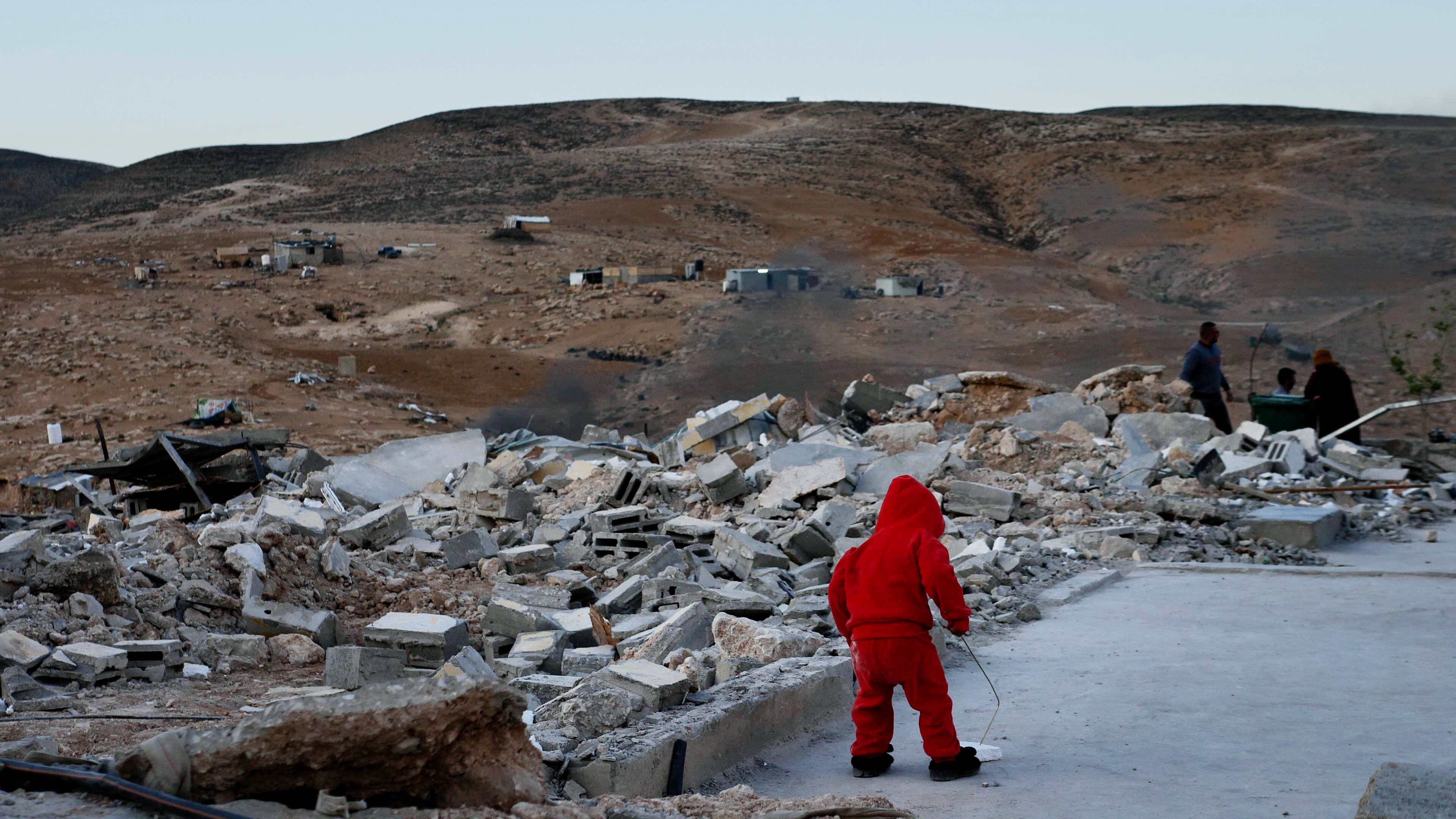 A child plays in the rubble of a demolished house in Masafer Yatta (supplied)