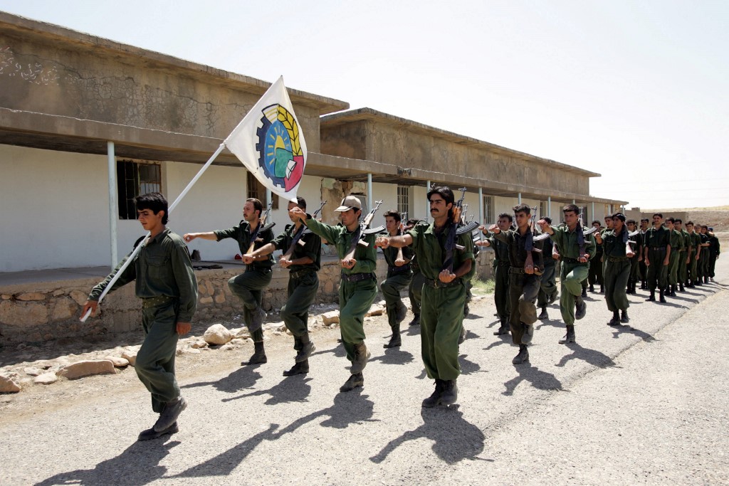 Peshmerga of the Democratic Party of Iranian Kurdistan (PDKI) march during military training at camp Koysancak in Sulaymaniyah in Iraq, 13 August 2005 (AFP)