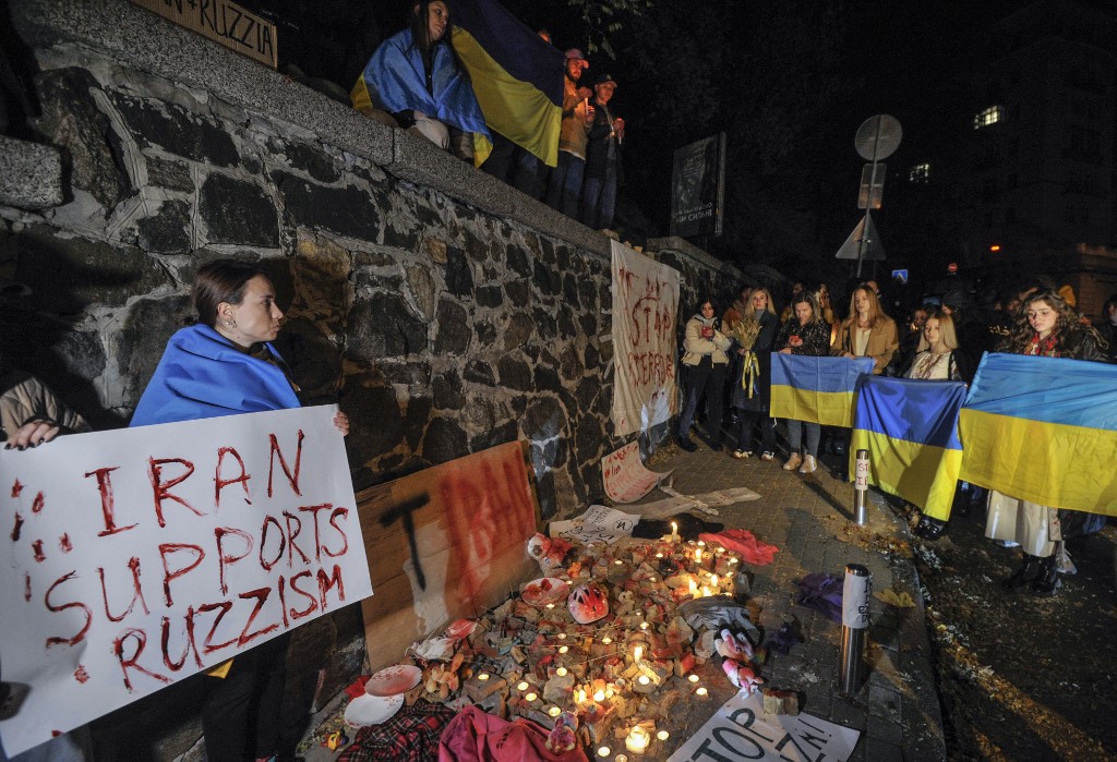 People demonstrate outside the Iranian embassy in Ukraine on 17 October 2022 in Kyiv, after the city was hit by swarms of kamikaze drones sold by Iran to Russia, leaving at least three dead (AFP)