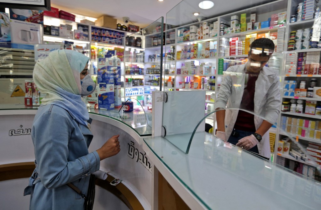 A woman shops at a pharmacy in the Iranian capital Tehran on 24 February 2020 (AFP)