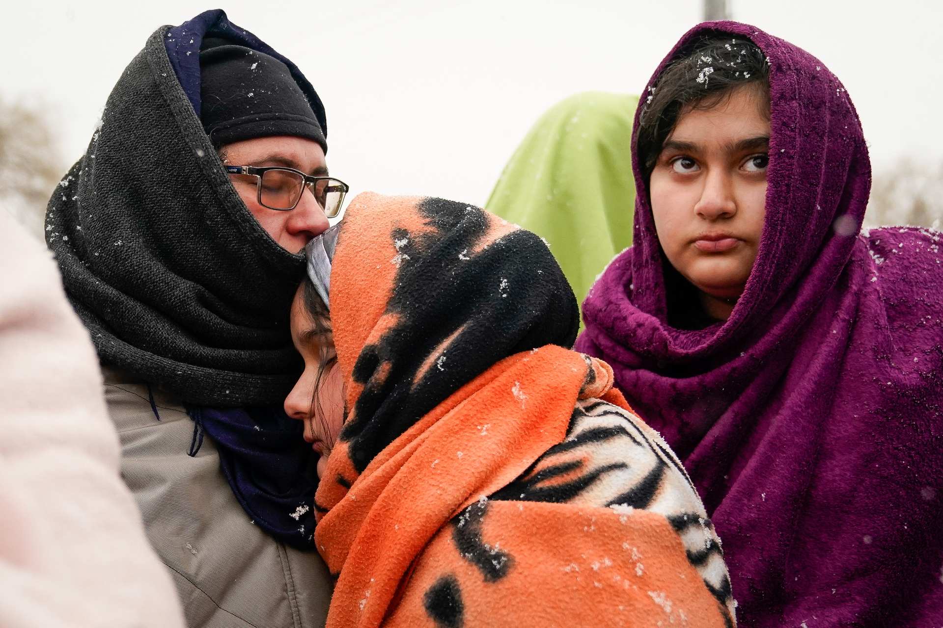 An Afghan family pictured among refugees arriving in Poland after fleeing from Ukraine in late February 2022 (Reuters)
