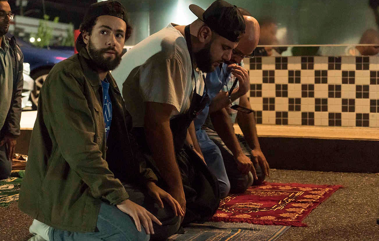 Ramy at prayer - but it fails to resolve his moral confusion (Hulu)