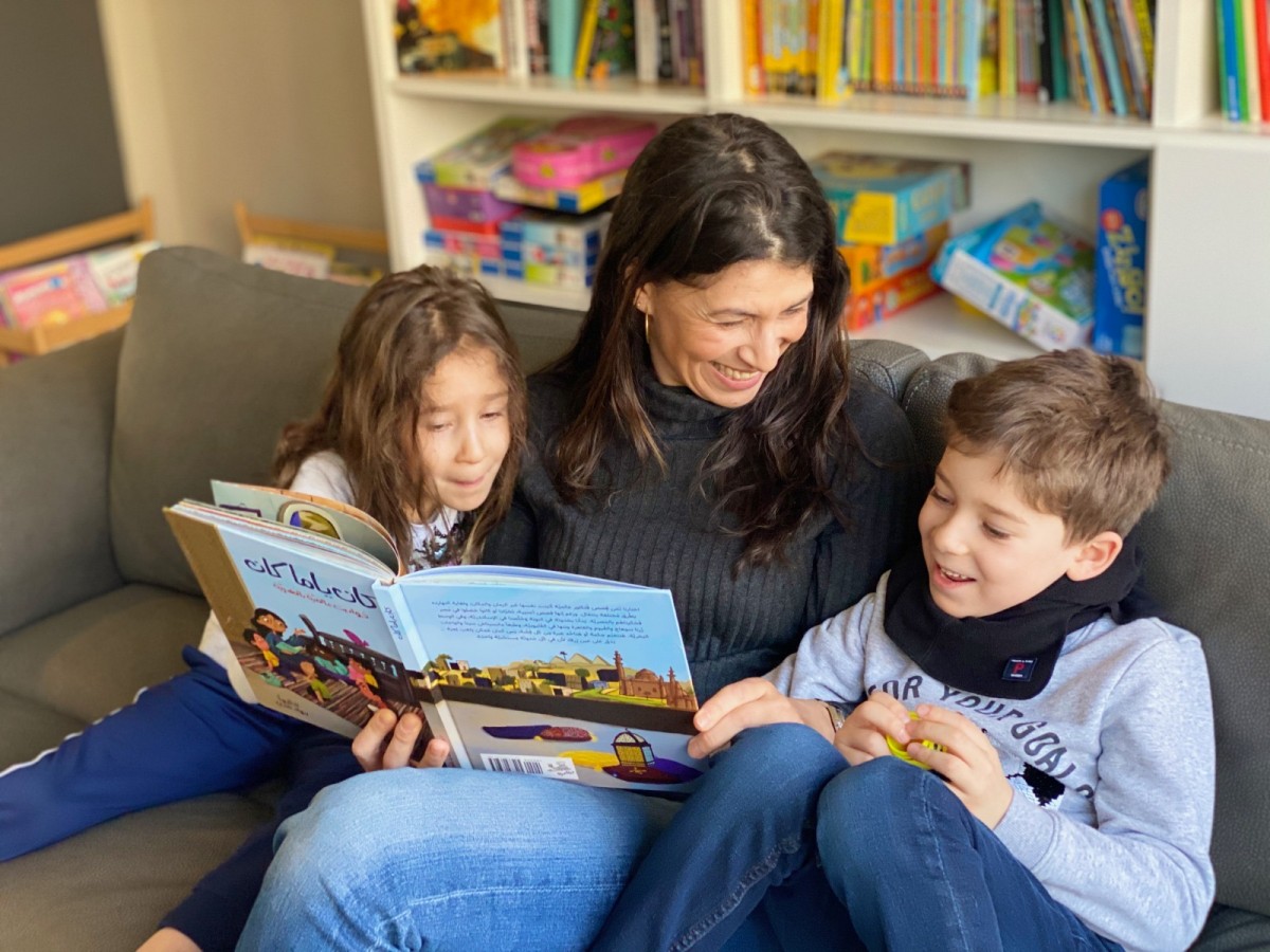 Riham Shendy reads to her twins from her new book, Kan Yama Kan (Courtesy of Riham Shendy)