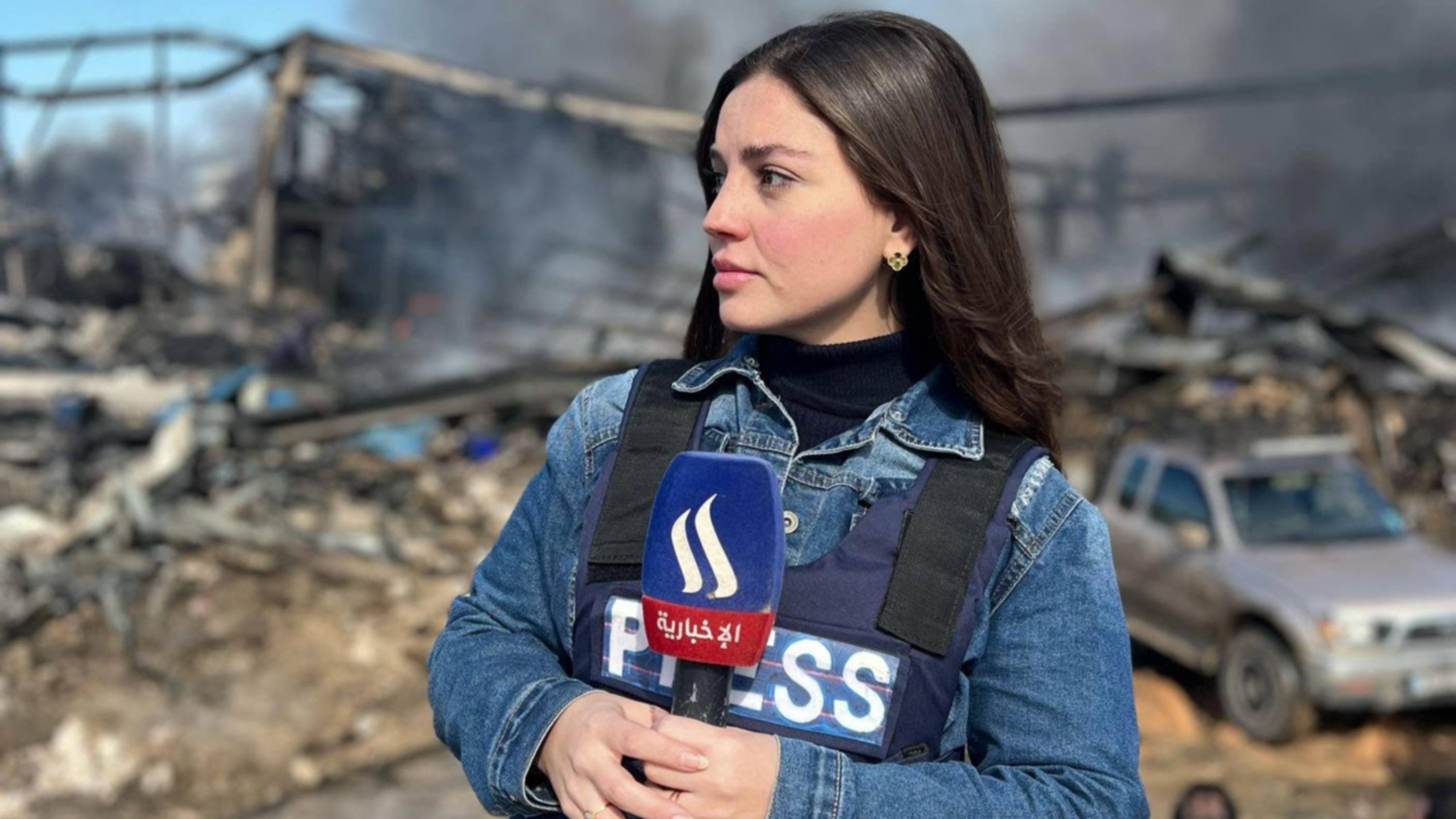 Lebanese journalist Sally Korfali reporting on an Israeli attack in south Lebanon (provided)