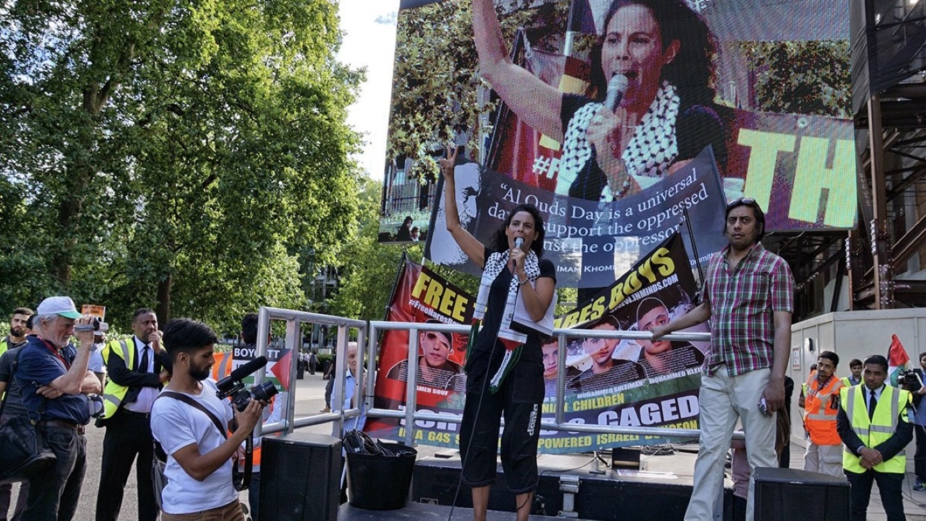 Sandra Watfa addresses a rally in London