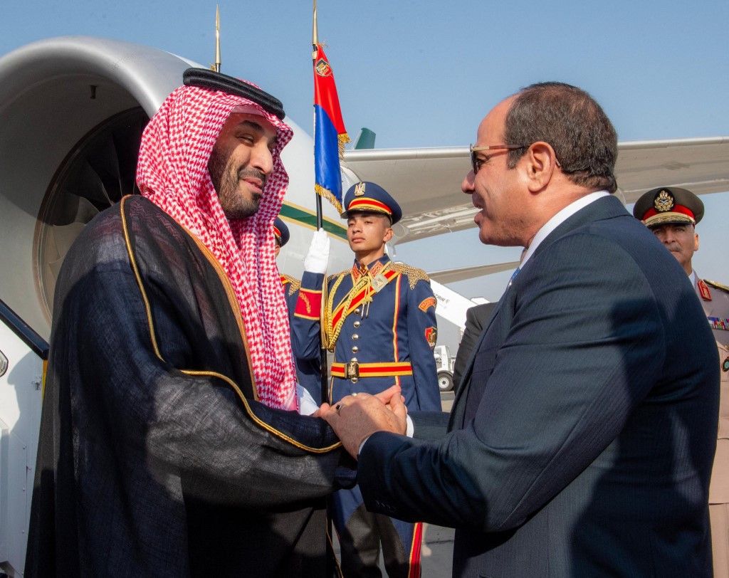 Saudi Crown Prince Mohammed bin Salman (L) being welcomed by Egypt's President Abdel Fattah el-Sisi upon in Cairo, 15 October 2024 (AFP)