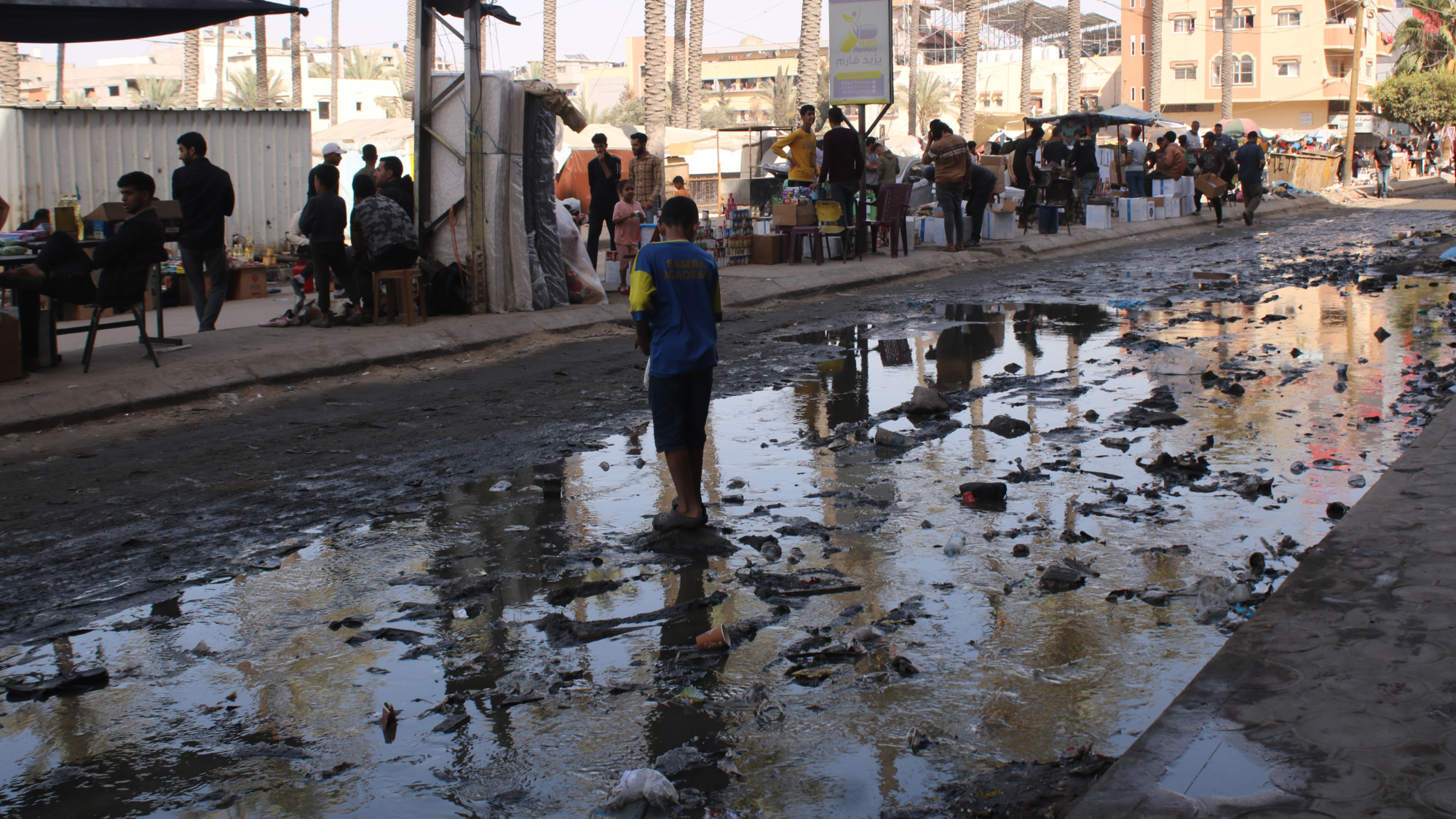 Overflown wastewater seen in a steer in Deir al-Balah in the Gaza Strip (MEE/Abdallah al-Naami)