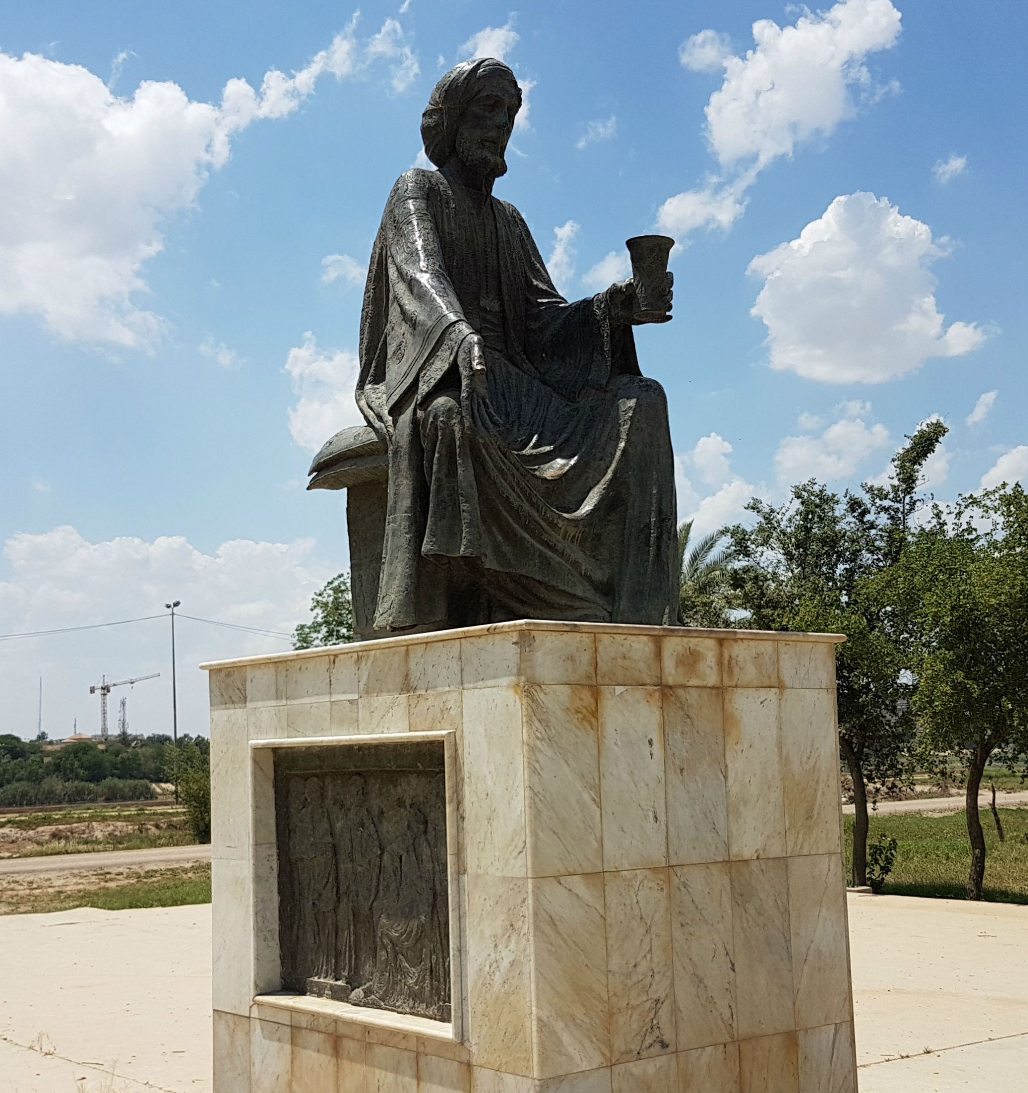 A statue of Abu Nuwas stands over a park in Baghdad (Alex MacDonald/MEE)