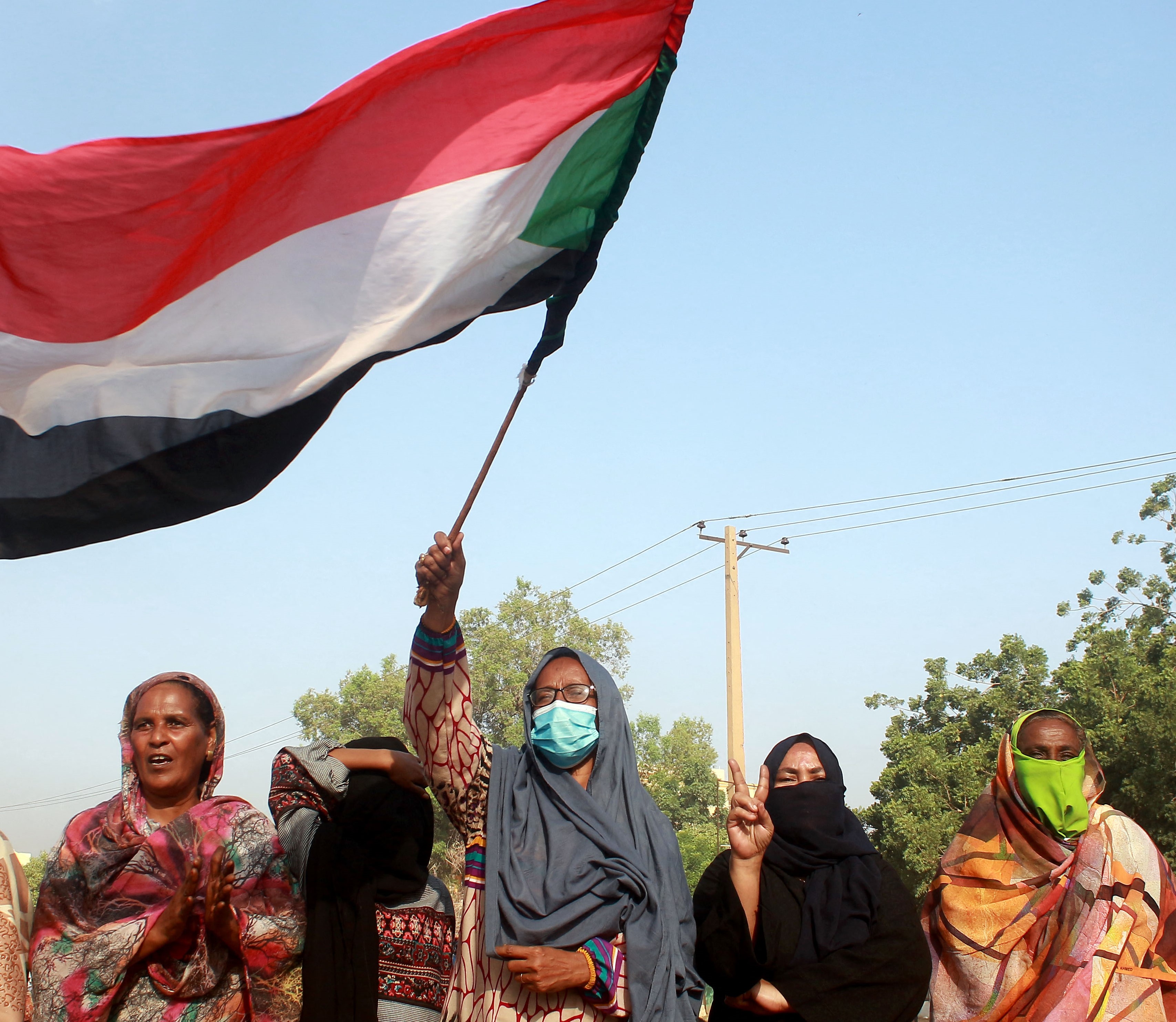 Sudanese protest against a military coup that overthrew the transition to civilian rule, on October 25, 2021 in the al-Shajara district in southern Khartoum