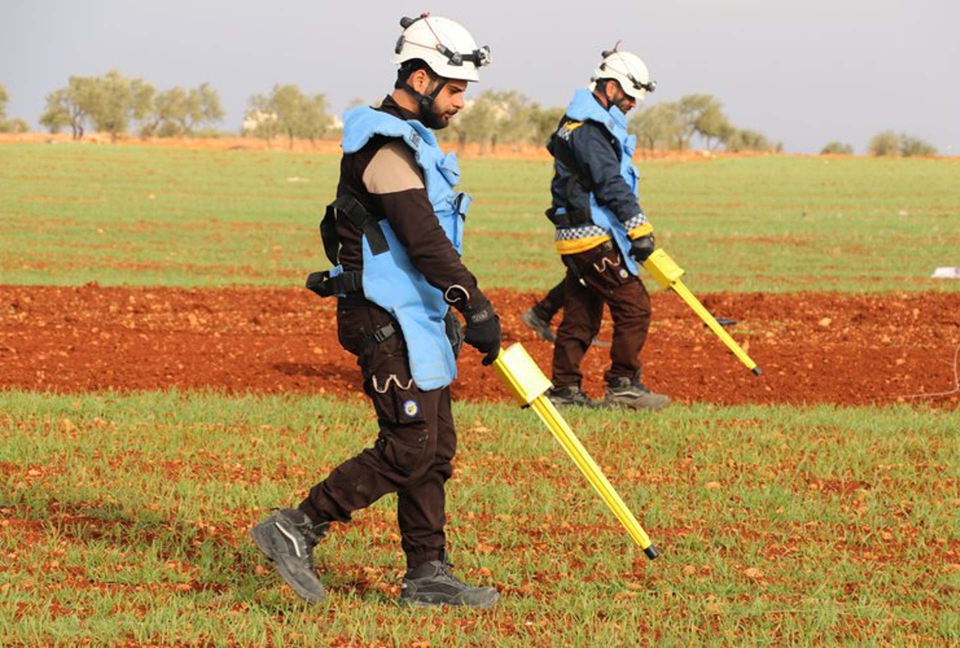 White Helmets volunteers search Syrian farmlands for unexploded ordnance (Syria Civil Defence)