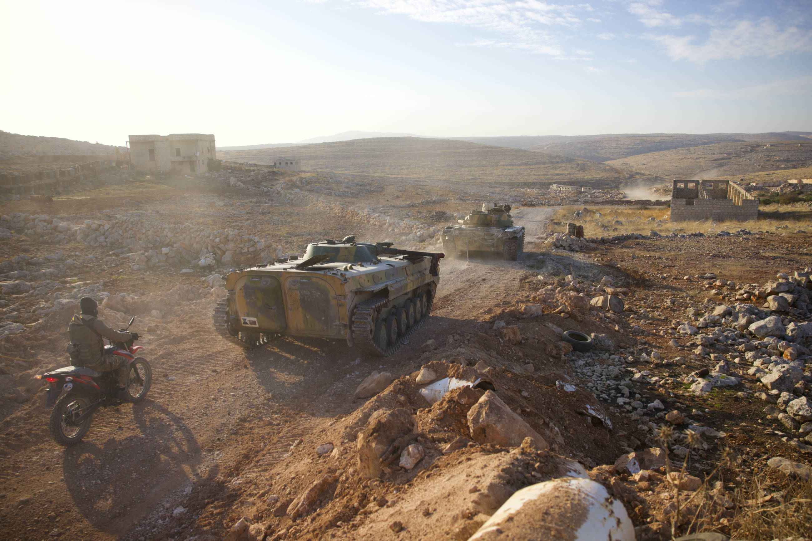 Rebel forces advancing west of Aleppo province during a military operation against Syrian and Iranian forces on 27 November 2024 (Mohamed Aldaher, MEE)