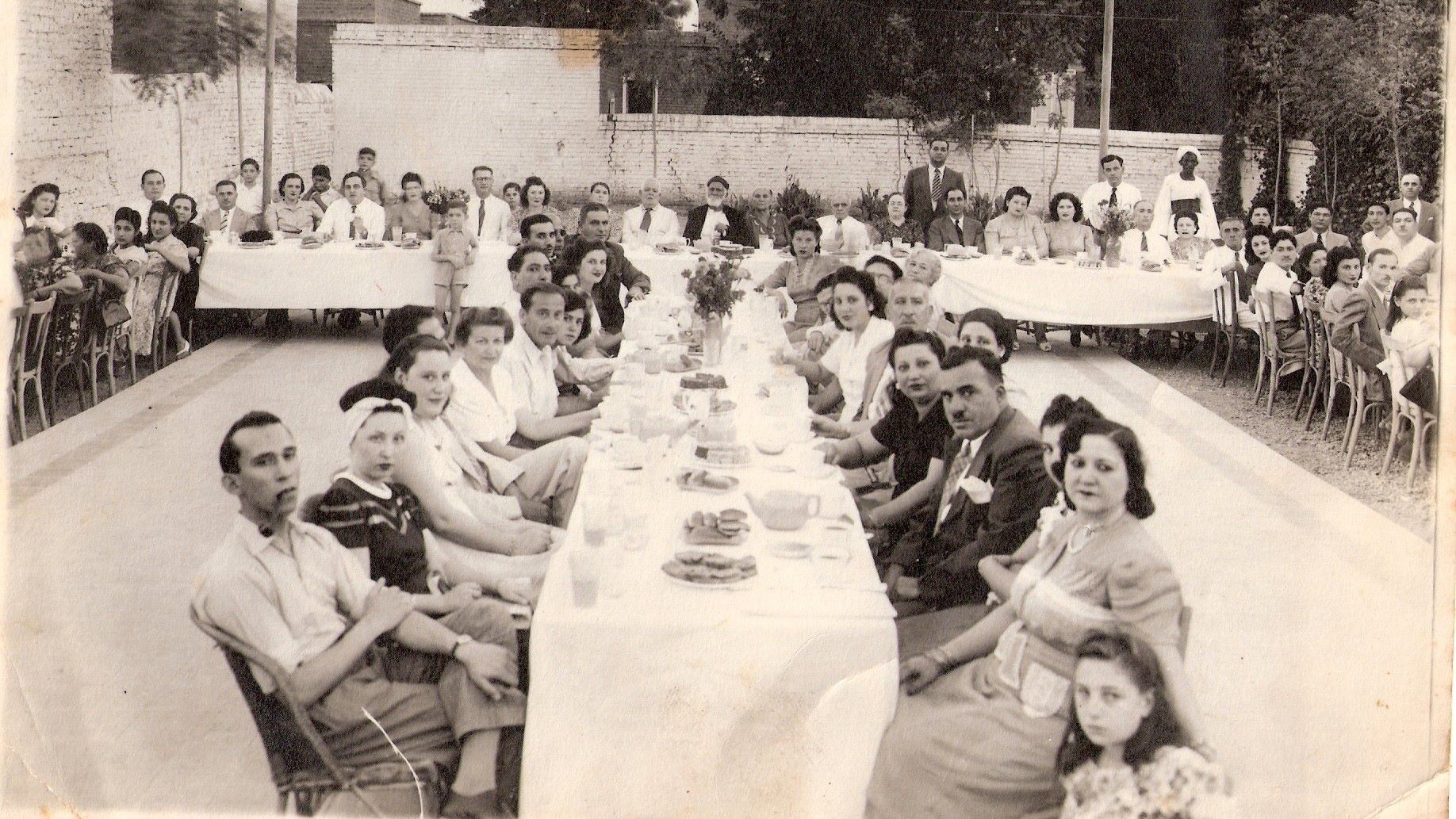 The Jewish Community of Sudan sharing a communal meal at the Jewish Recreational Club in 1947 (Tales of Jewish Sudan)