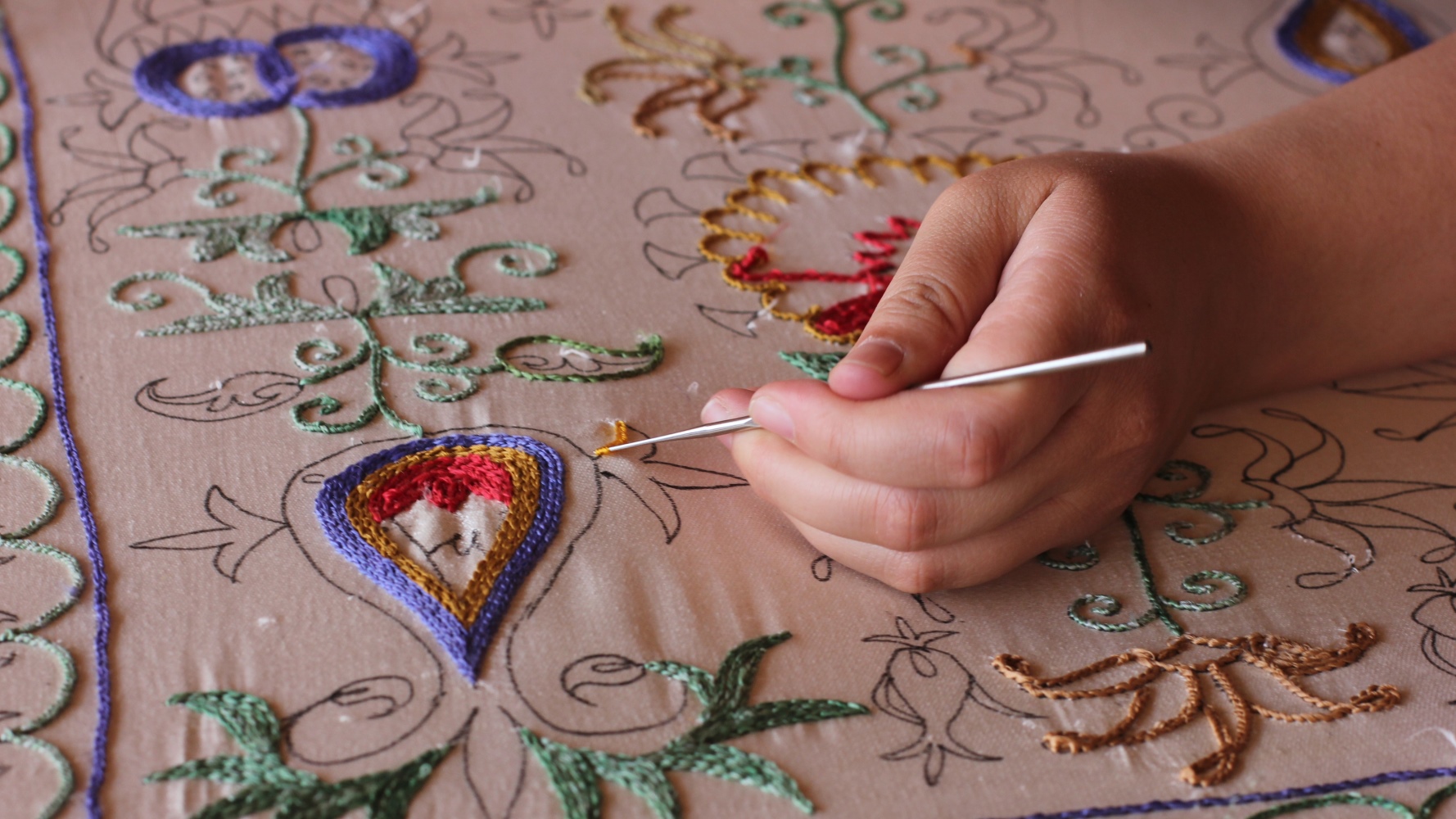 Tojiyeva doing embroidery
