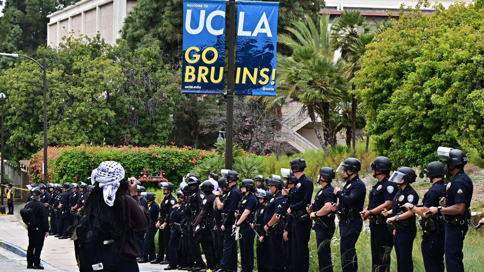 Police line up outside the University of California, Los Angeles (UCLA) campus after clearing a new pro-Palestine student encampment, in Los Angeles, California on 23 May 2024 (Frederic J Brown/AFP)