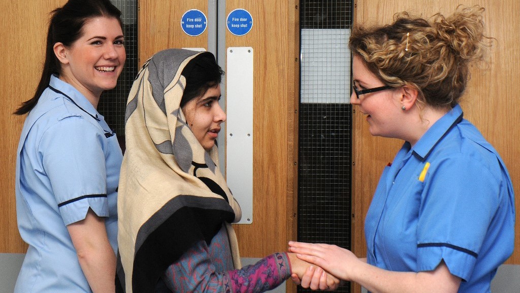 A handout picture recieved on January 4, 2013 and taken January 3, 2013 from the Queen Elizabeth Hospital in Birmingham shows injured 15 year-old Pakistani schoolgirl Malala Yousafzai hugging a member