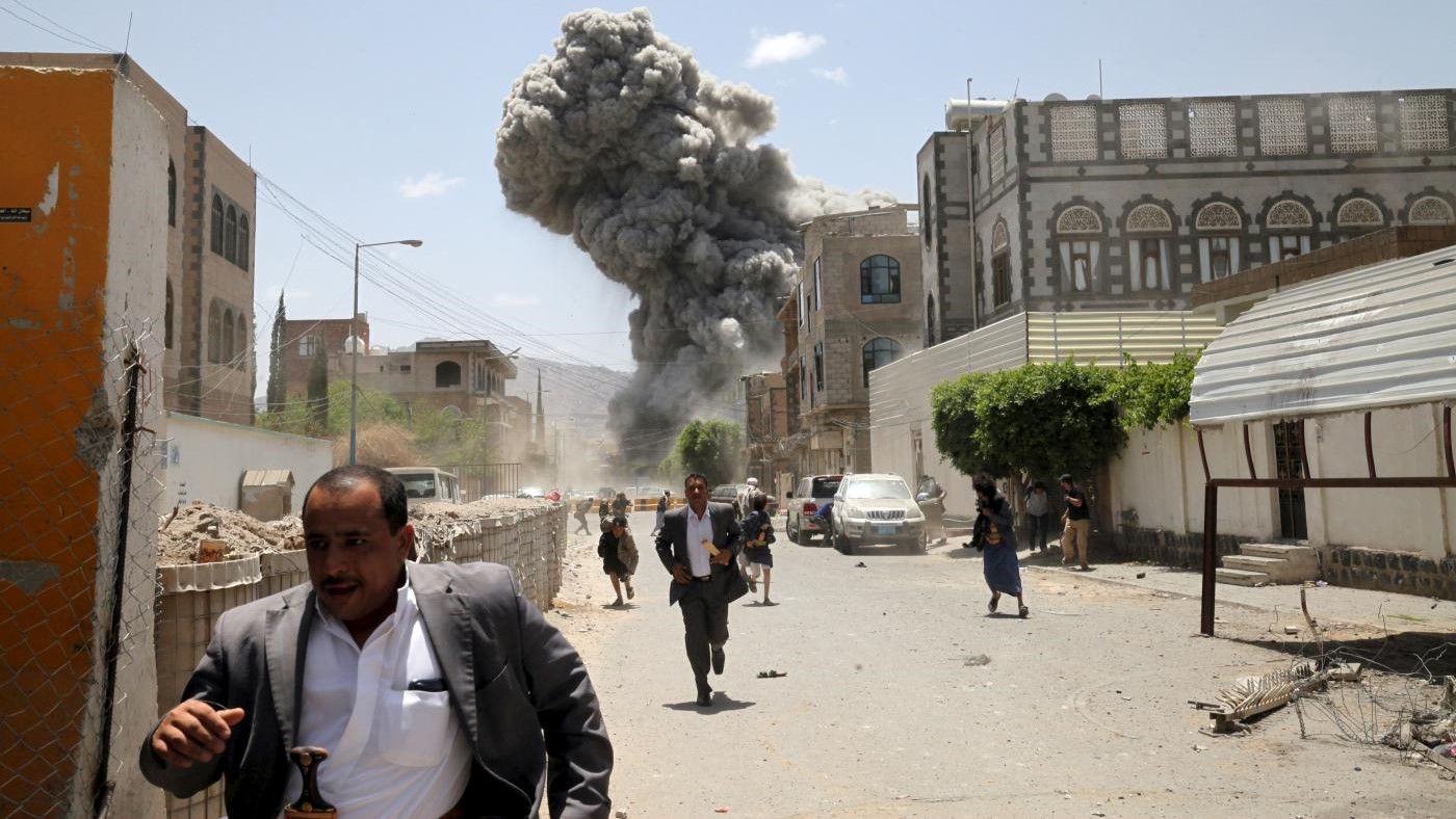 Yemenis flee as air strikes hit the Yemeni capital Sanaa on 10 May, 2015