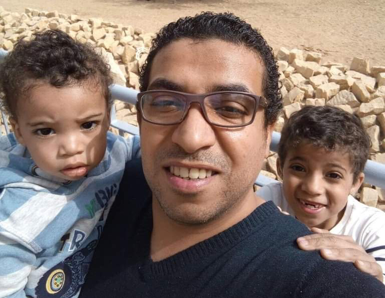 Abdelrahman ElMady taking a photo with his two sons in 2016 in Saudi Arabia.