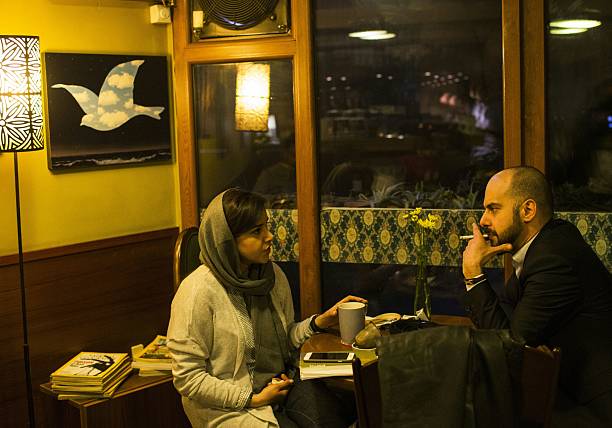 A couple sits in a cafe in Tehran (AFP)
