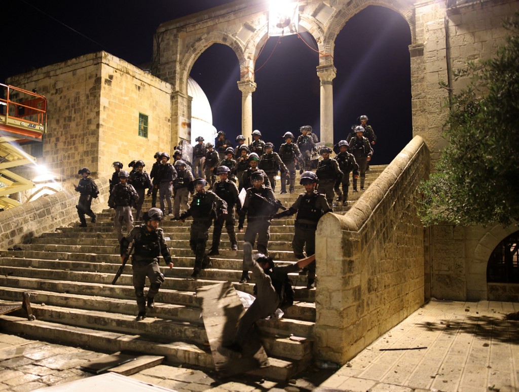 Israeli security forces raid Jerusalem’s al-Aqsa Mosque on 10 May 2021 (AFP)